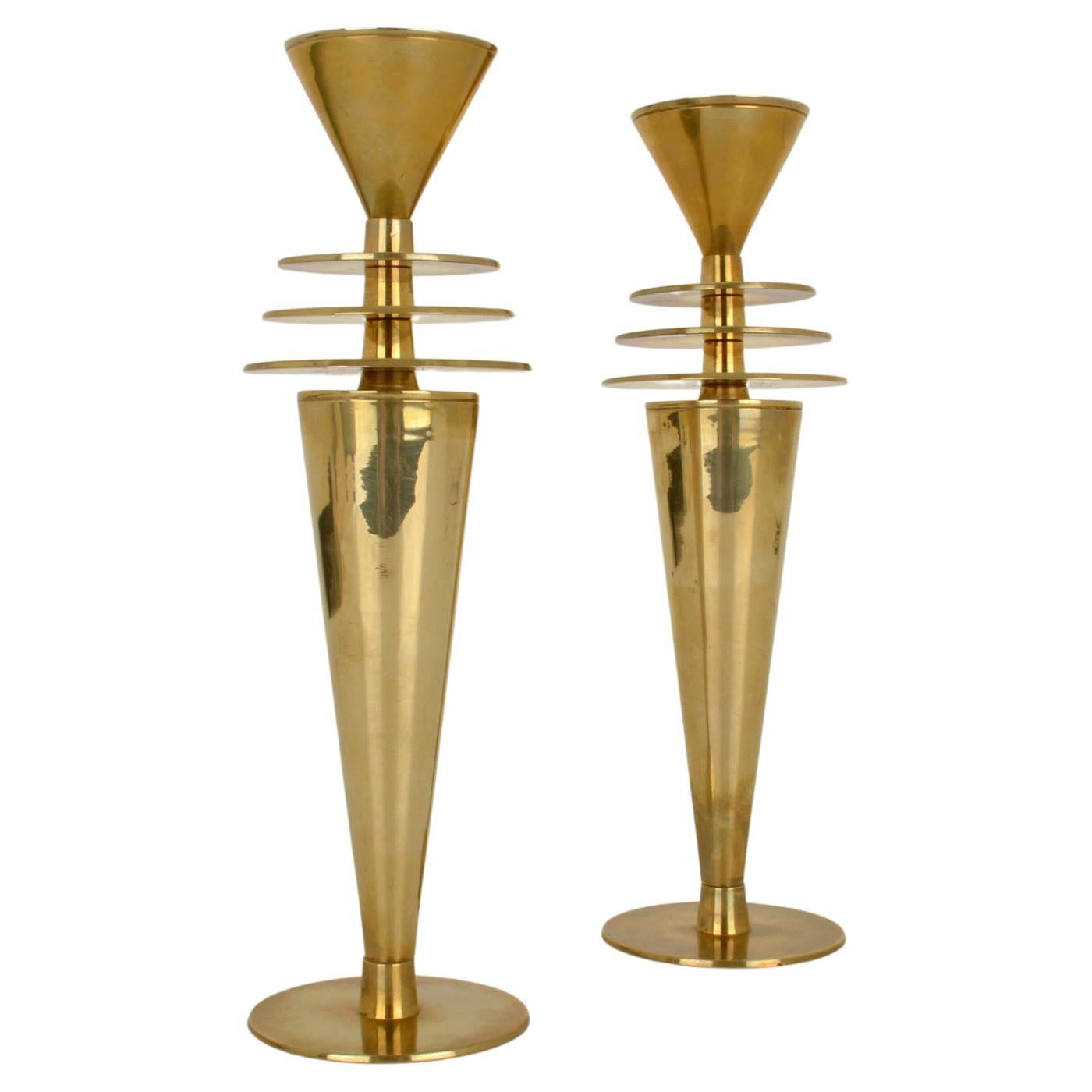 Pair of Post Modern brass candle sticks inspired by Art Deco style and Modernism. They are beautiful example of engineering.
Suitable for regular candles.