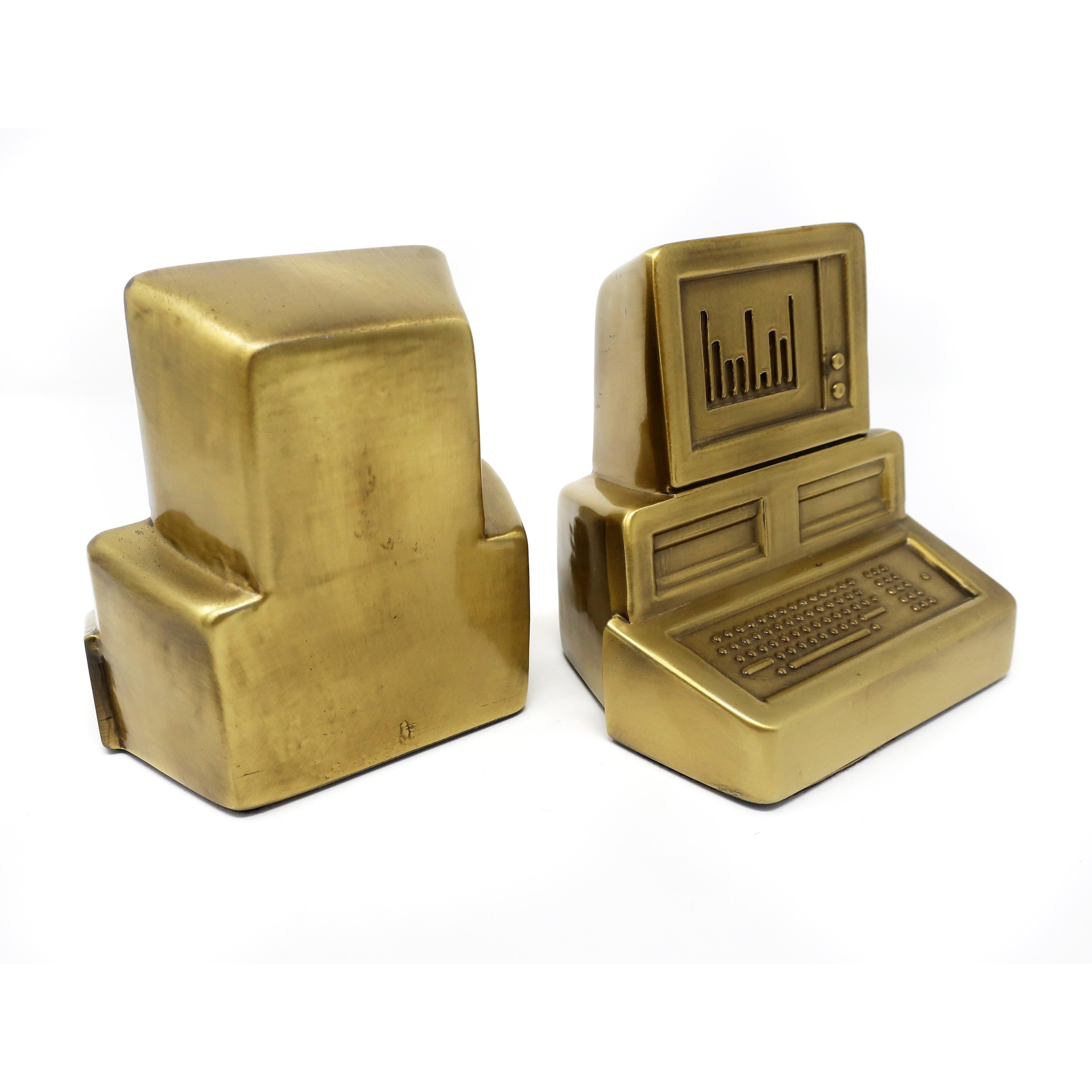 An amazing pair of 1980s brass personal computer bookends. Postmodern perfection that will keep all your vintage MS-DOS, Windows 2.0, and Commodore computer manuals organized. (They work with all other books too!)

In excellent vintage