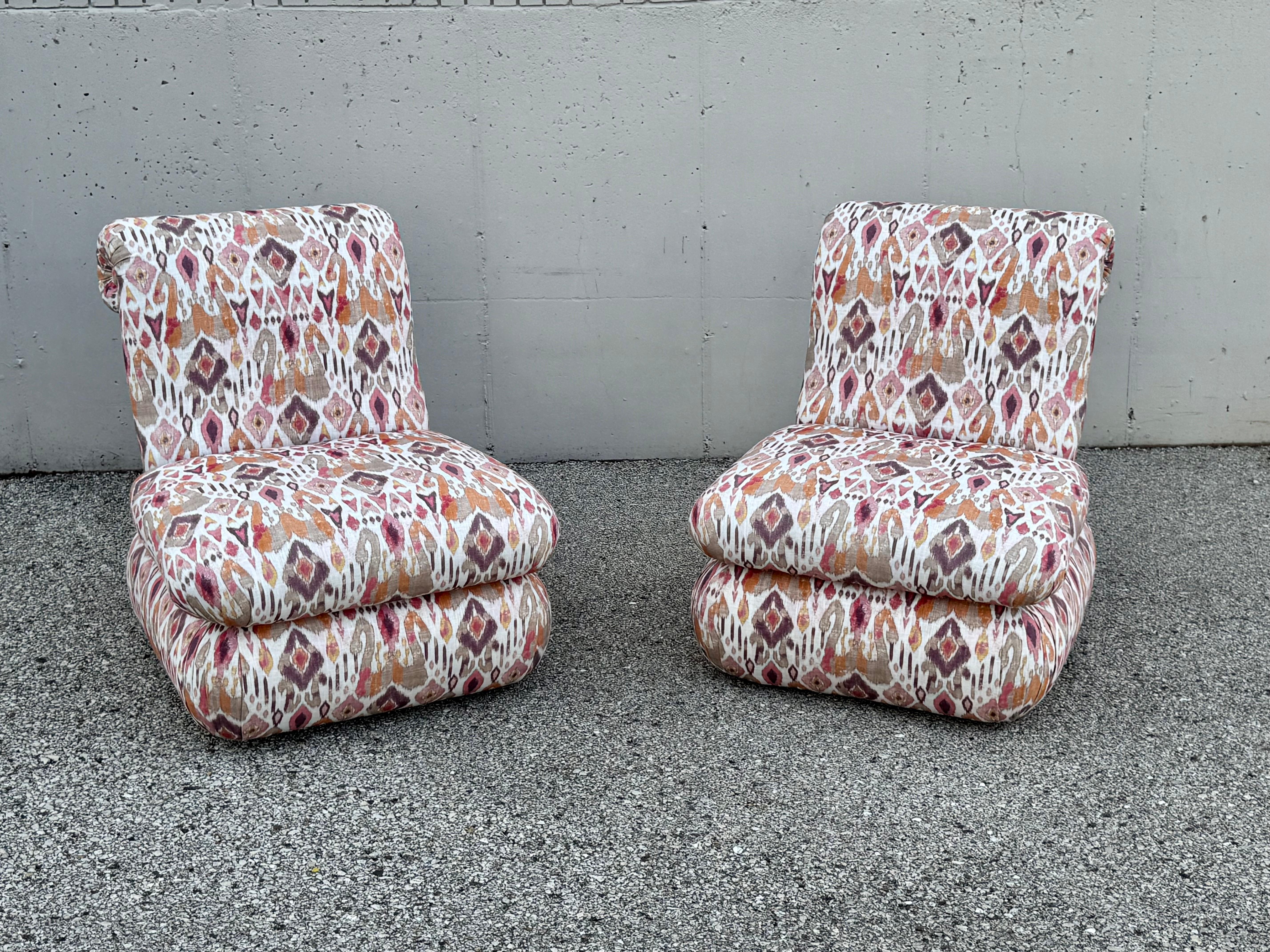 The word Comfort comes to mind when sitting in these large scale circa 1980 plush and fully upholstered Angelo Donghia designed scroll back slipper chairs, with original Donghia designed ikat Malay-Indonesian inspired fabric. Lean back and relax, as