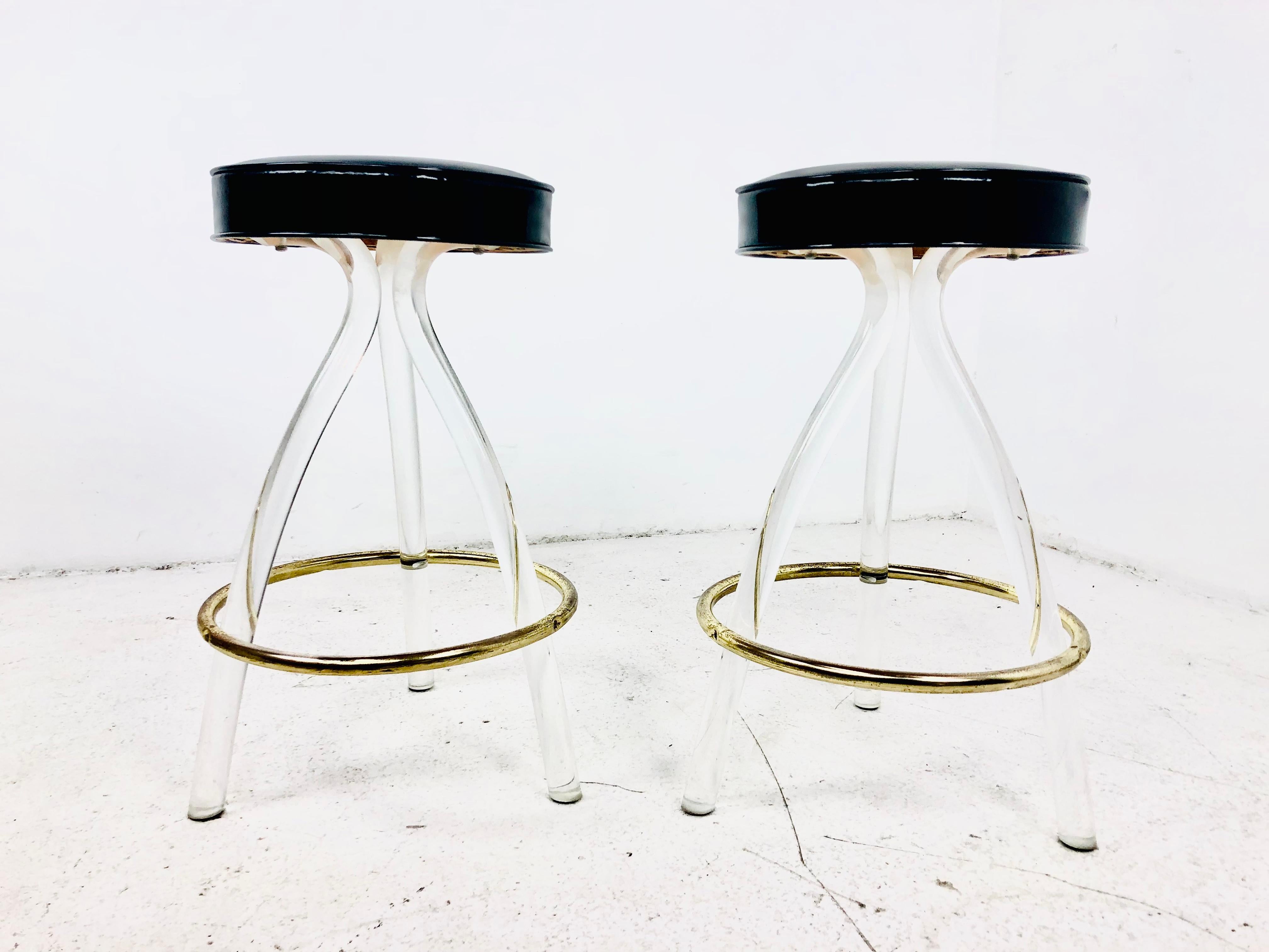 Pair of 80's modern lucite barstools with black vinyl seats. Good vintage condition. Coordinating bar available in separate listing.