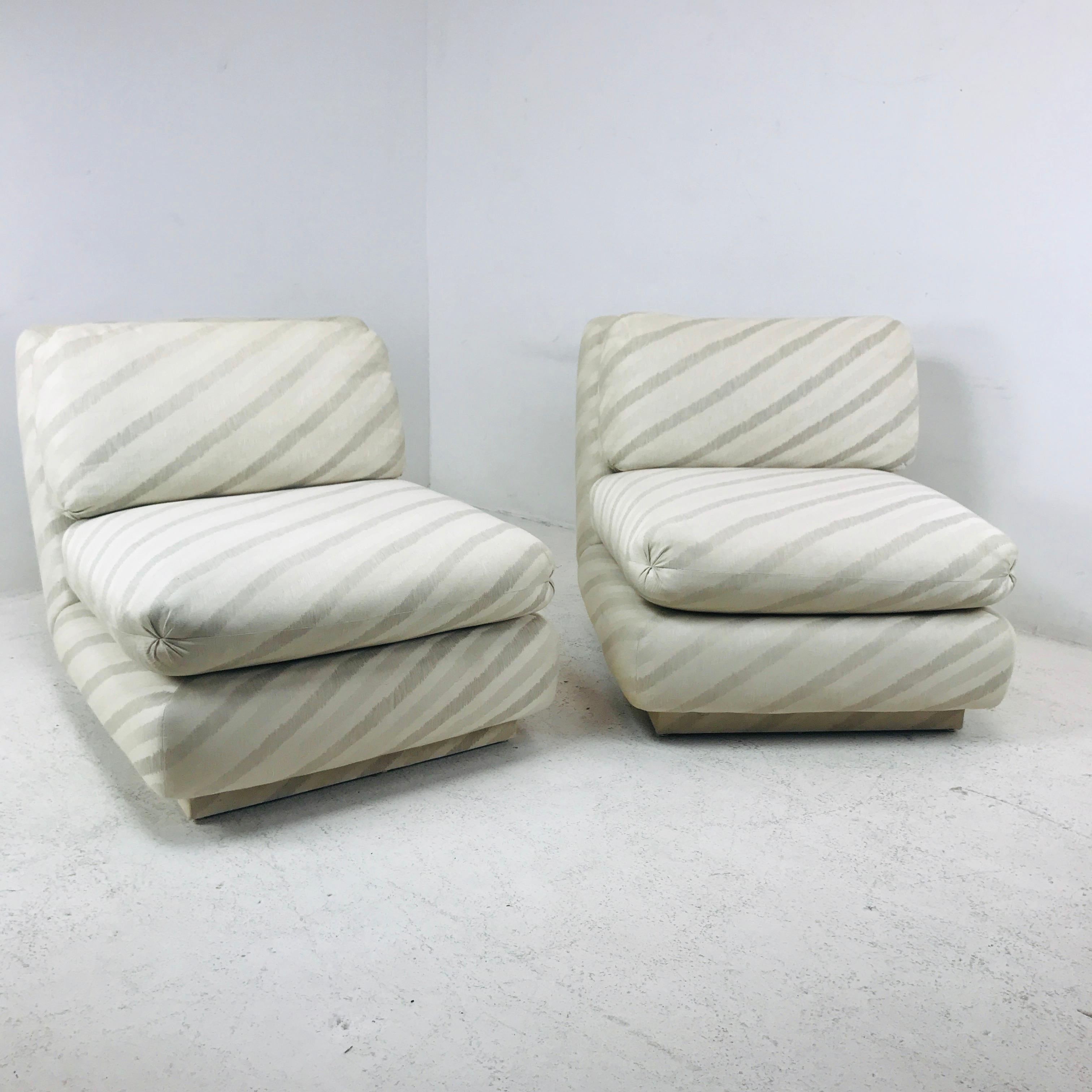 Lovely, upscale pair of 1980s slipper chairs designed by Marge Carson, California. Great back slant design. Original tags.