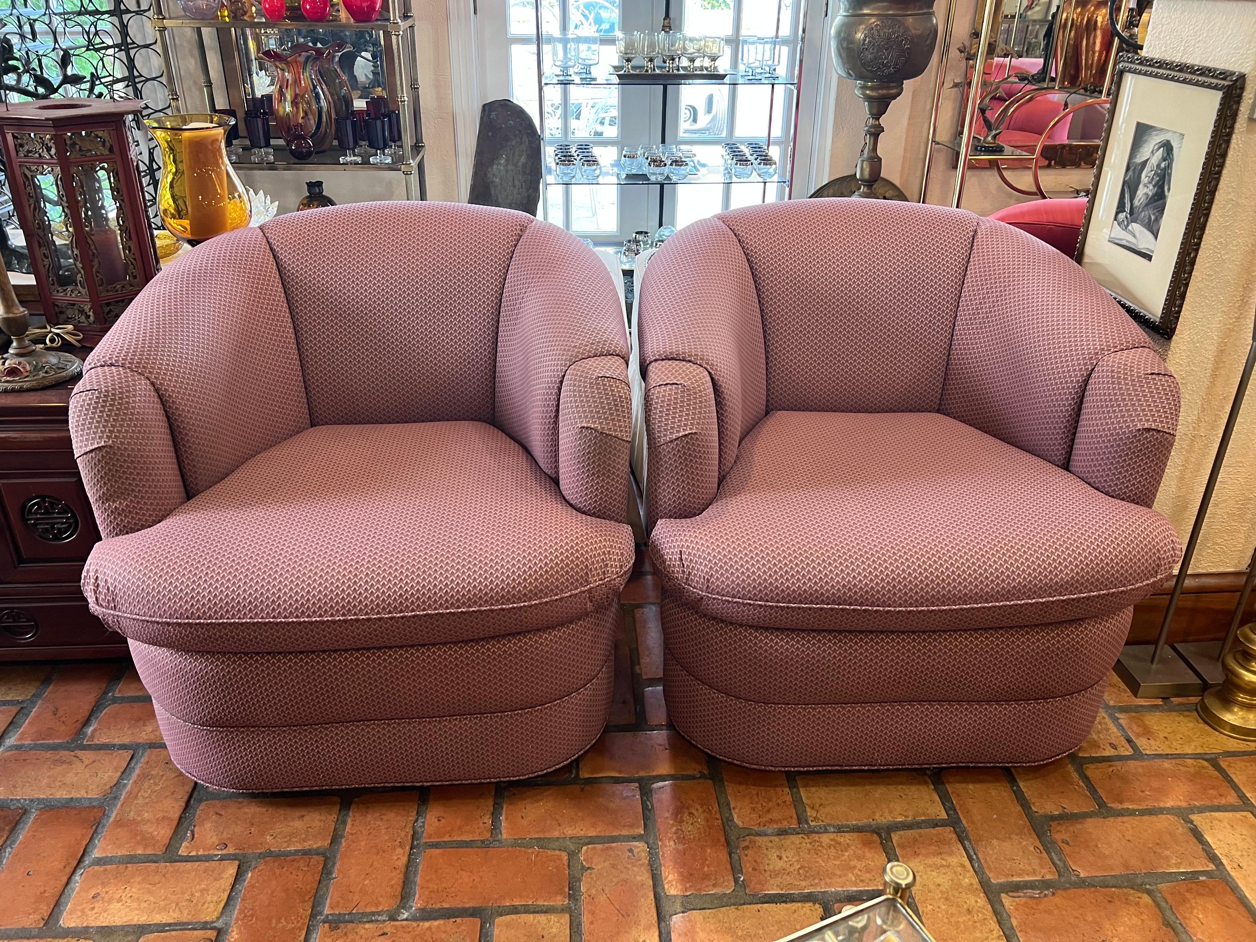 Pair of 1980's Mauve Swivel Chairs. Perfect for that Post Modern 1980's home. Large size and super comfortable. Upholstery is very durable and in great condition.  