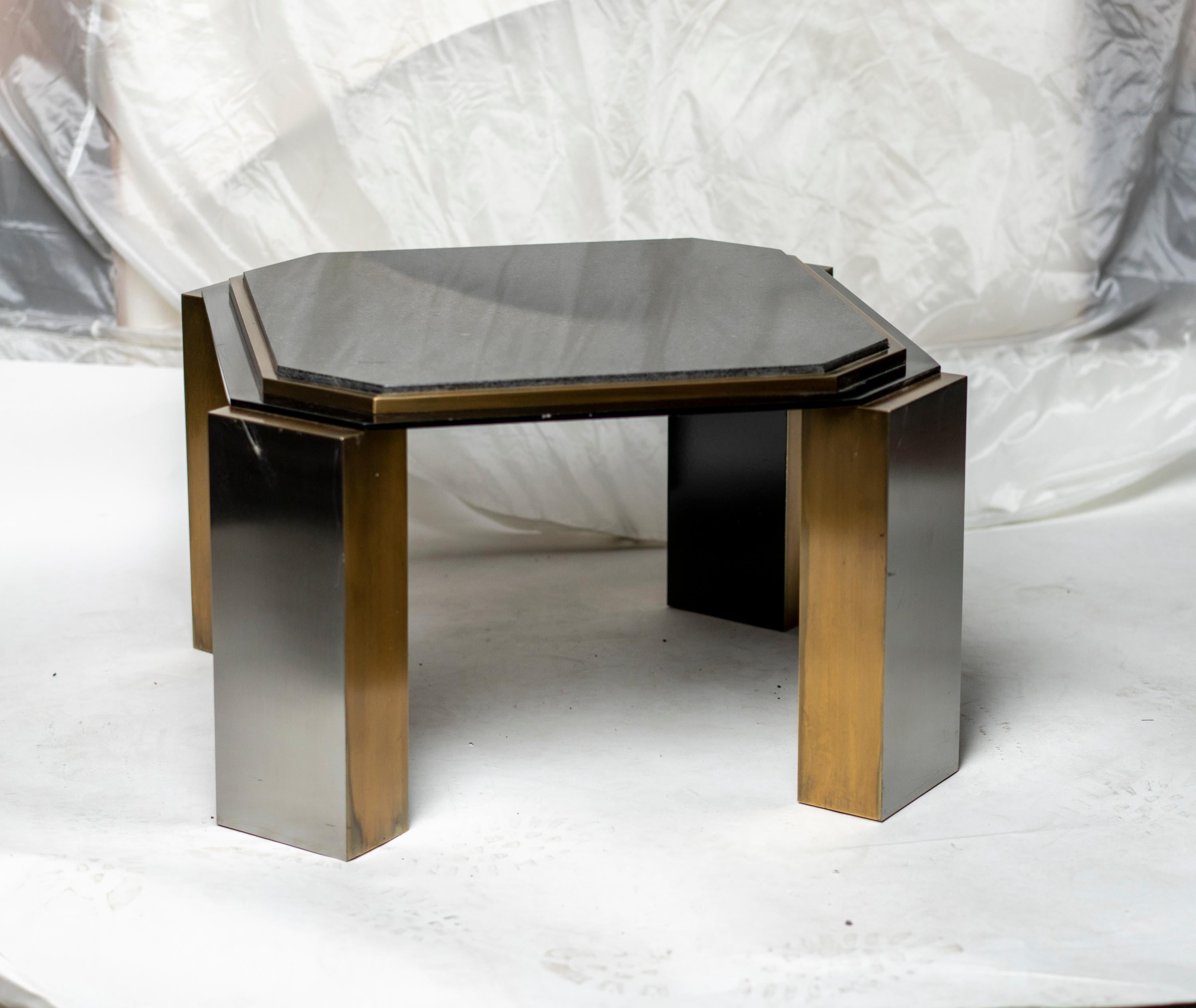 Pair of modernist black steel and polished brass square side tables inset black granite top
A third table also identical is available.
 