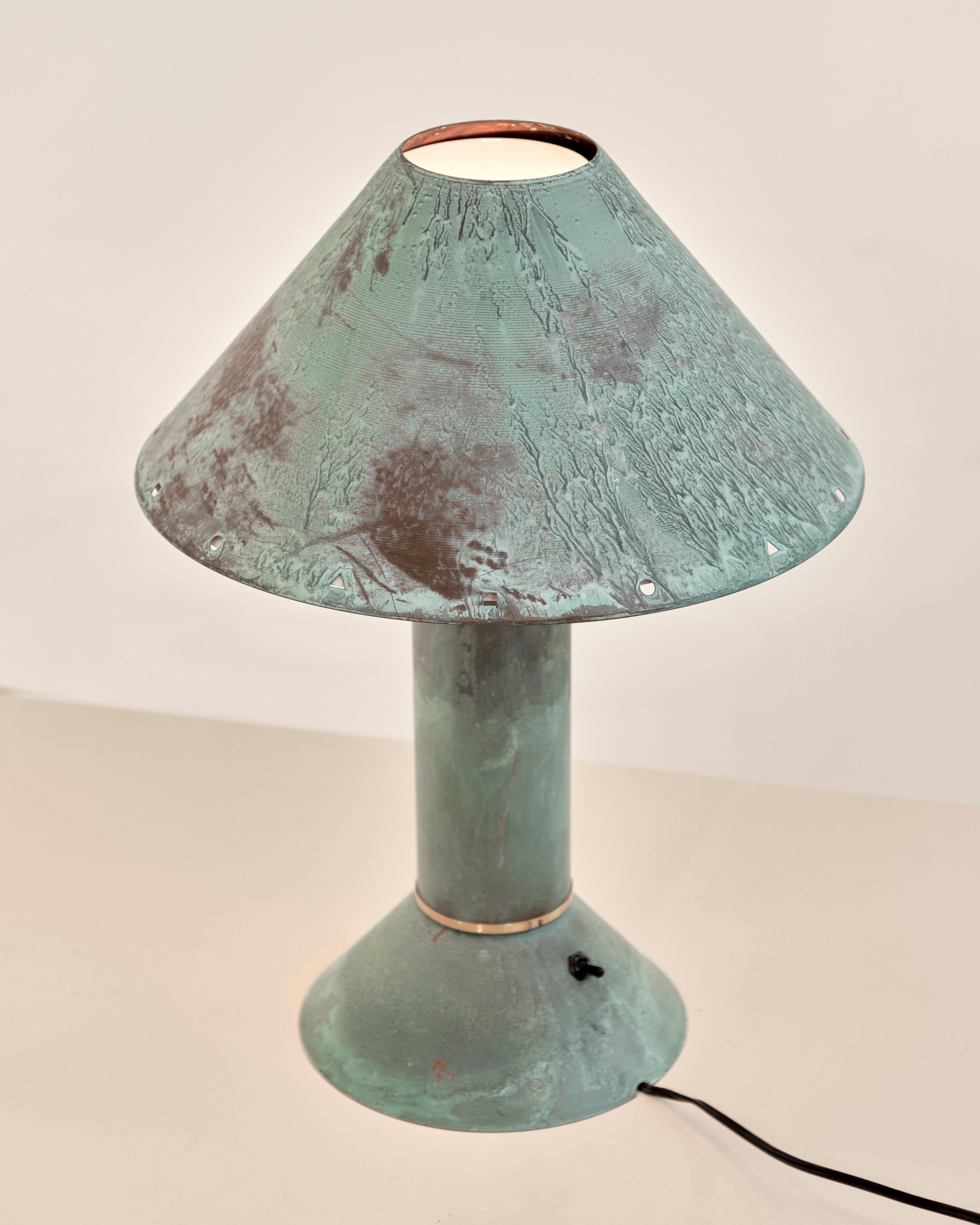 Pair of 1980's Patinated Copper lamps by famed Postmodern Californian designer, Ron Rezek. More commonly found in galvanized metal, this pair in oxidized copper are much more rare and sought after. In great condition. 