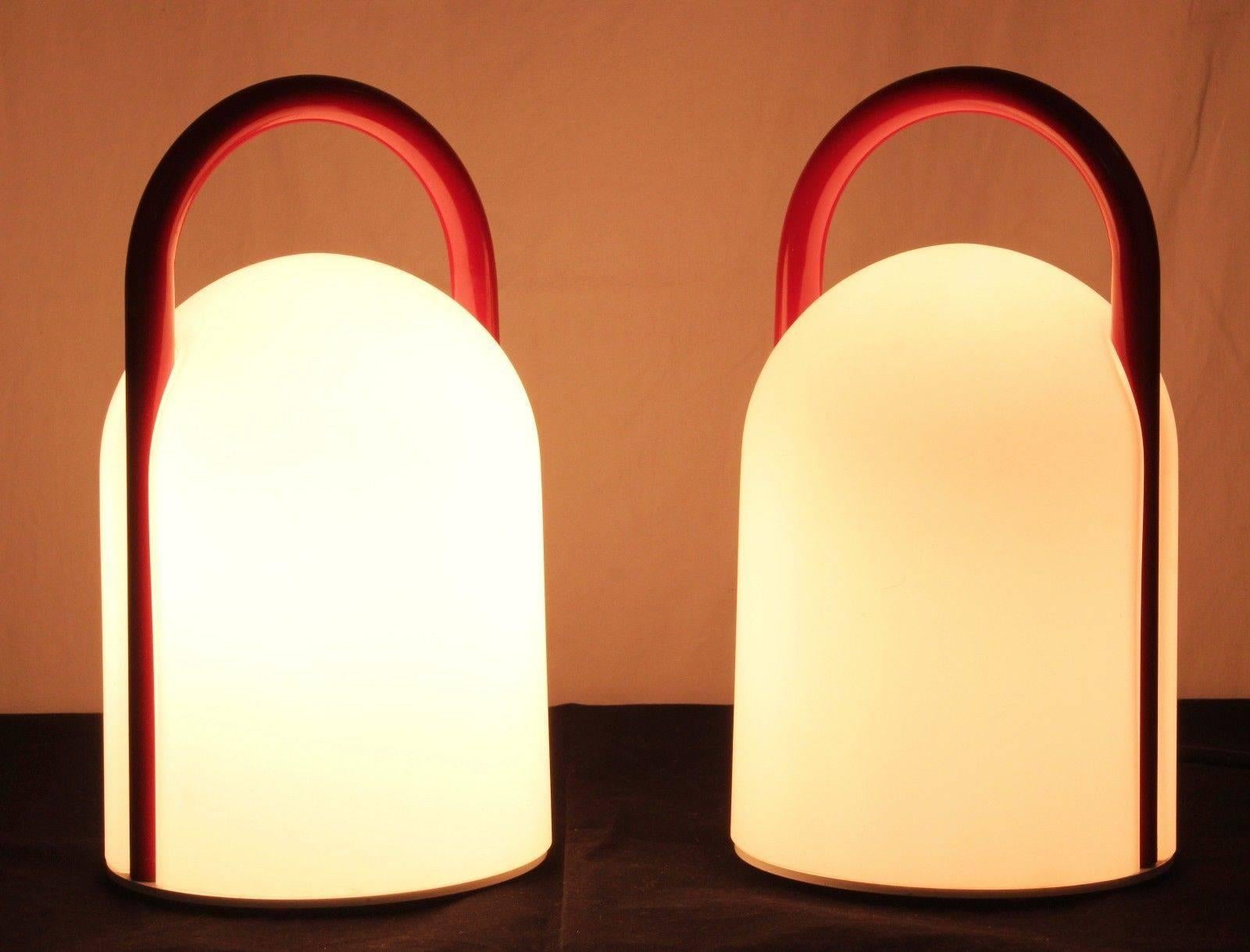 Pair of 1980s Romolo Lanciani Tender Table Lamps for Tronconi. Executed in opaline glass and red enameled metal, Italy, circa 1980s. A surprisingly refined and minimal design, especially for its time and place. 

Price is for the pair. Three lamps