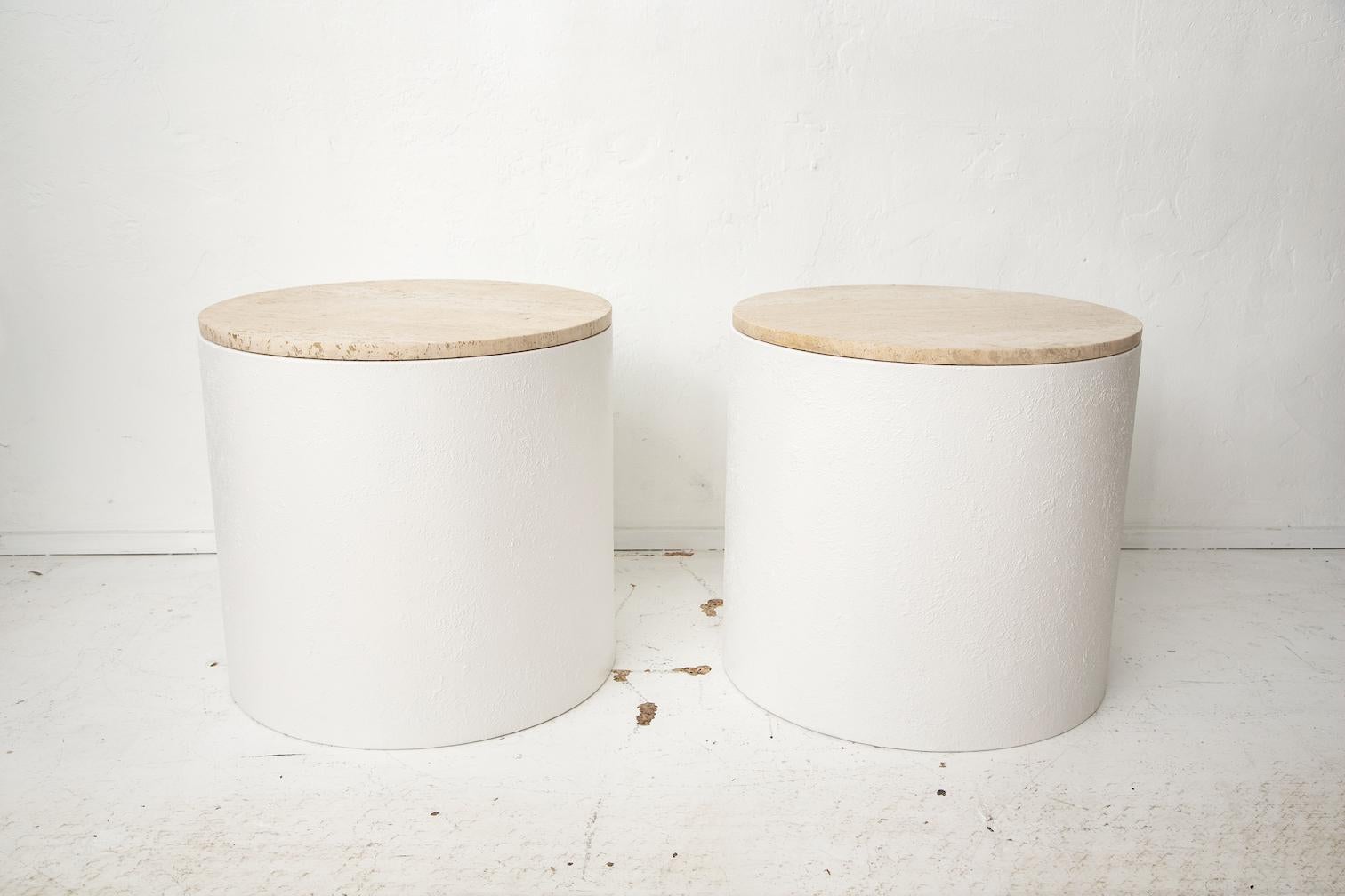 These impressive end tables are made of painted metal to resemble stone with travertine stone tops.
They can be used indoors or outdoors, or pulled together as a larger center table.
Beautiful neutral color palette.