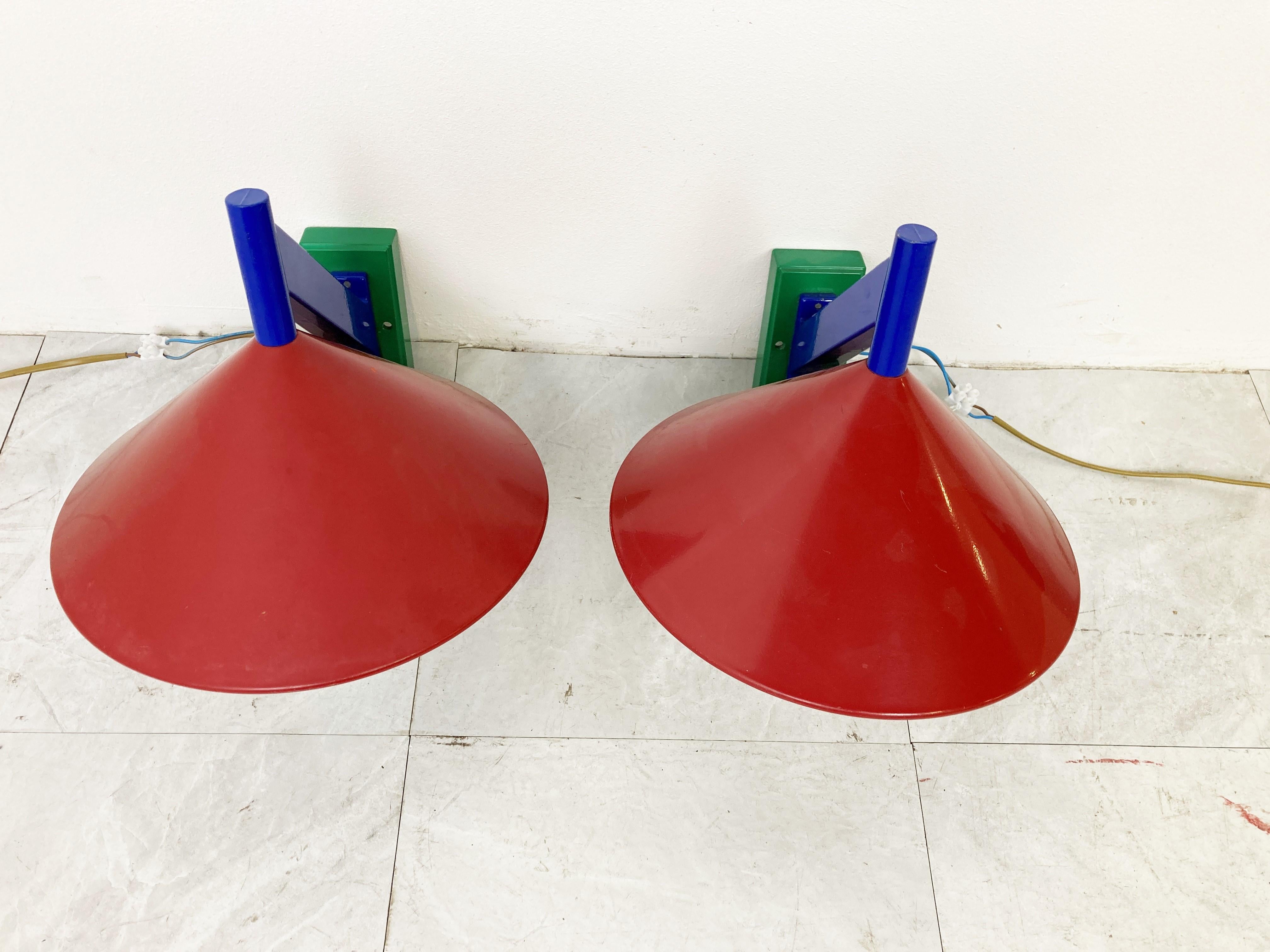 Pair of memphis style colourful opaline wall lamps.

The lamps emits a soft light thanks to the opaline shades.

Good condition, tested and ready to use. 

1980s - Belgium

Dimensions:
Height: 32cm/12.59
