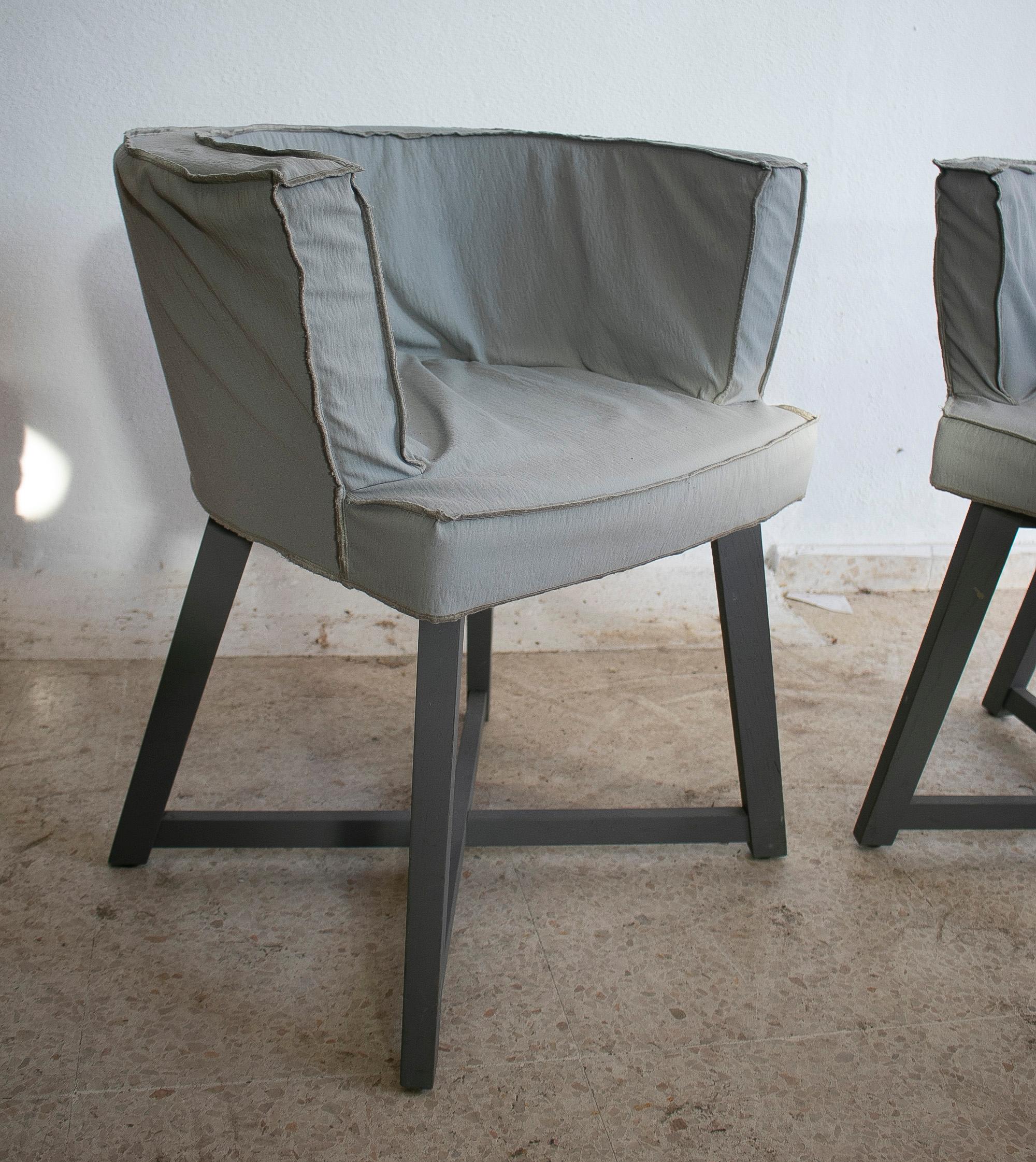 Pair of 1990s Italian Gervasoni edition wooden armchairs with fabric covers.

  