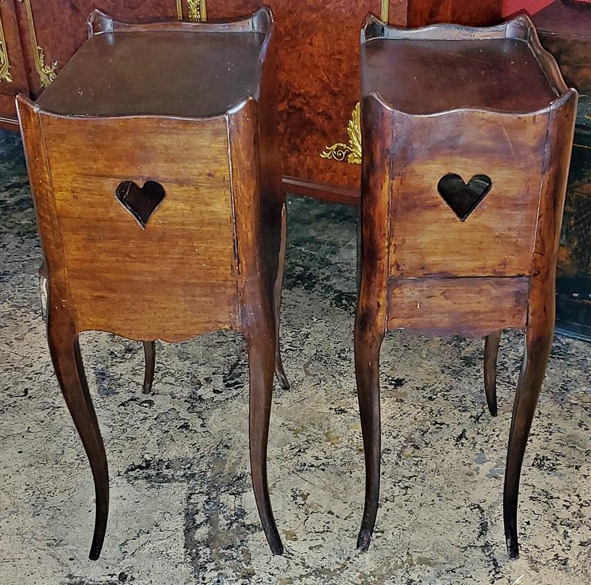 Presenting a very nice pair of 19th century French Country walnut side tables.

Made in the mid-19th century, circa 1850-1860 of solid walnut.

The first table (on the left) is larger with a pull out drawer on the base.

Each table has a top