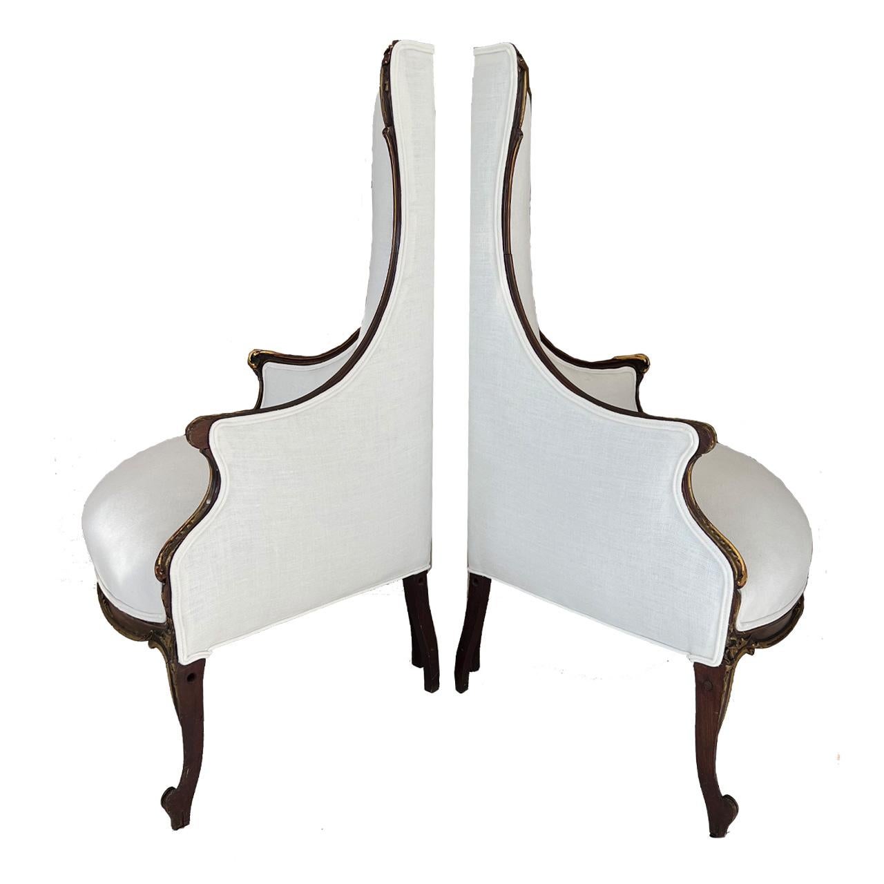 Corner chairs that demand attention. Wood with gilded accents and new white Belgian linen upholstery make these chairs a stand out.