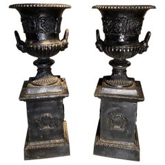 Pair of 19th/20th c Black Painted Cast Iron Classical Handled Urns w/ Pedestals