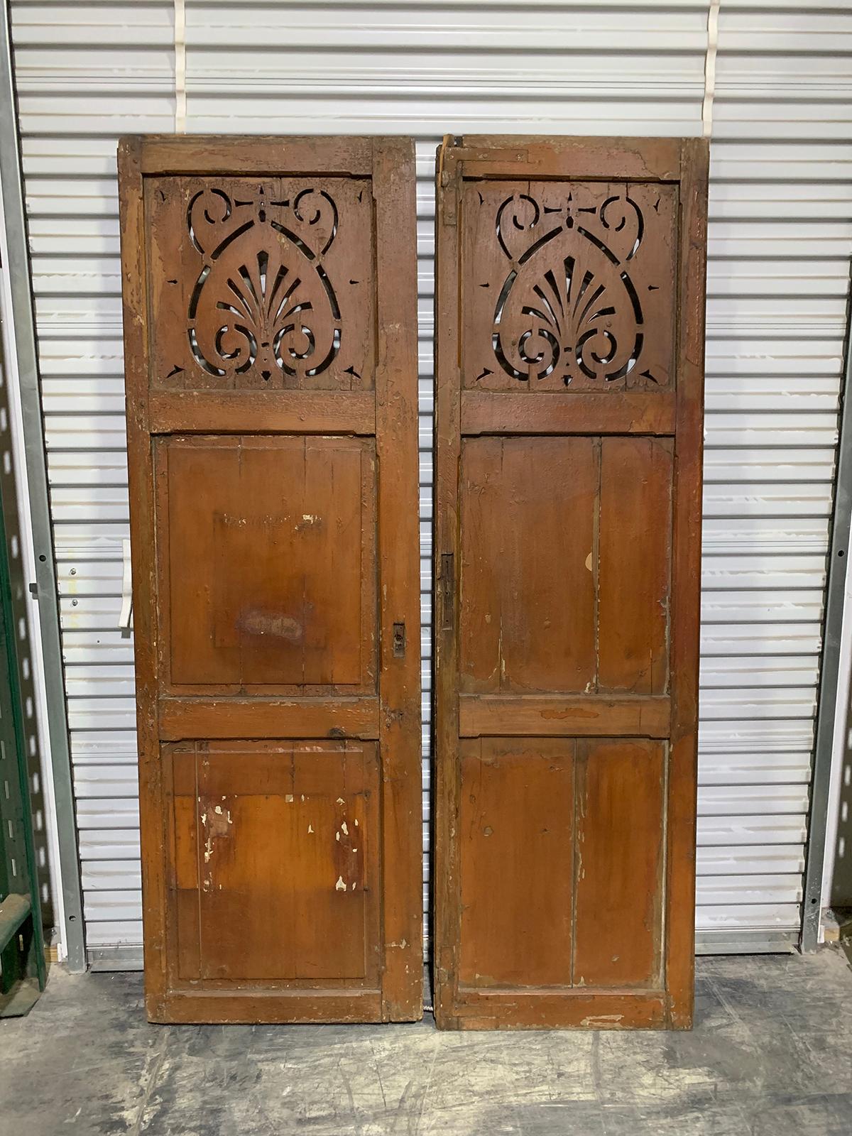 Pair of 19th-20th century American painted shutters with pierced top panel.