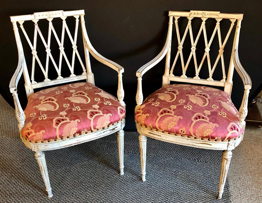 Pair of 19th-20th century armchairs in a Scalamandre upholstery having a Swedish Finish. These French Louis XVI style chairs are wonderfully painted having fine carvings and are all pegged and doweled. The seats having clean Scalamandre upholstery