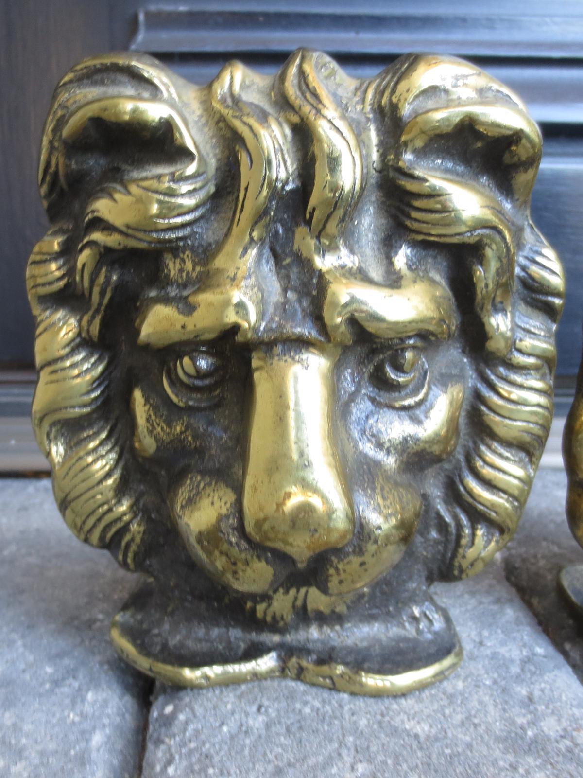 Pair of 19th-20th century bronze lion head bookends.