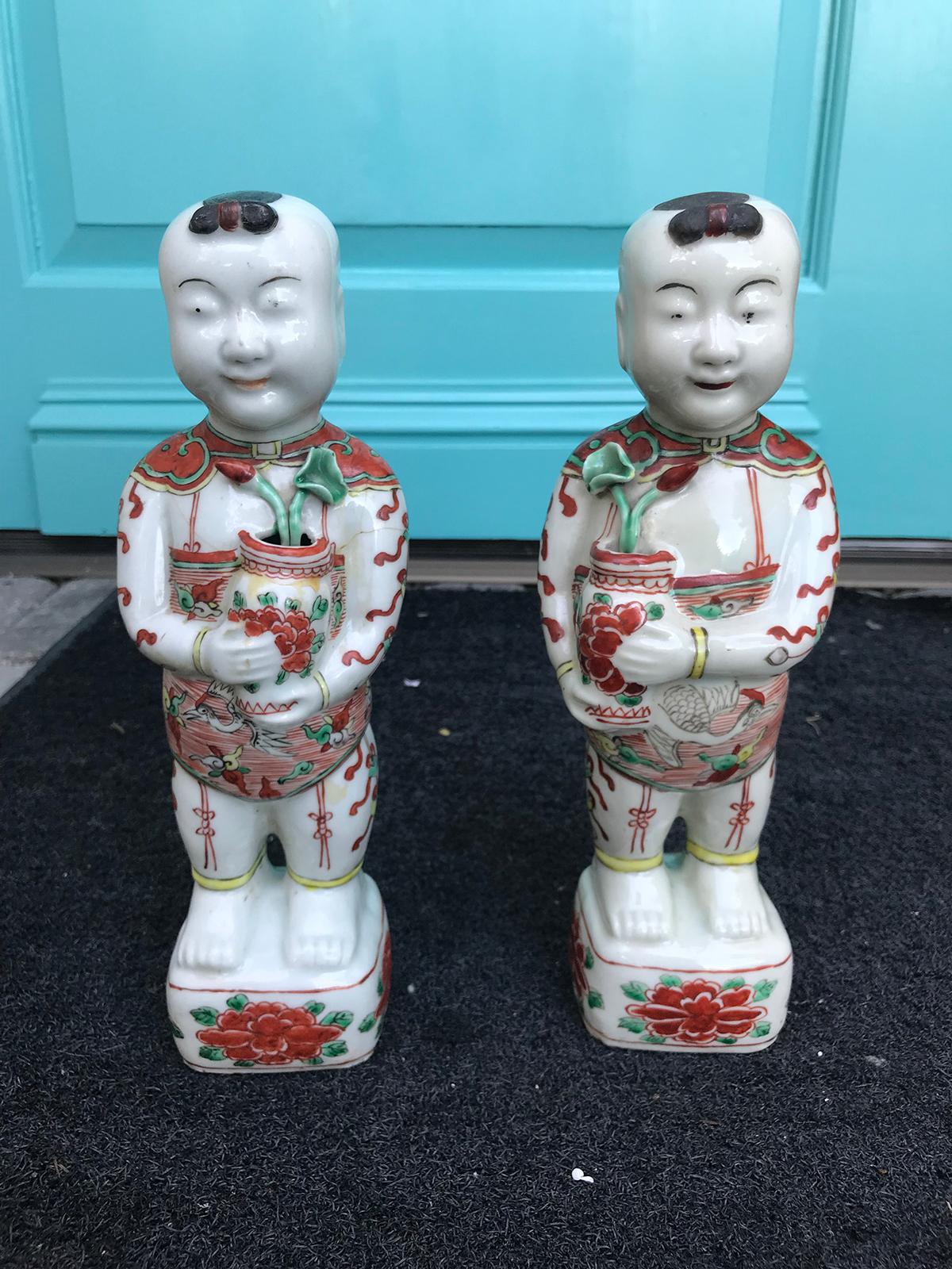Pair of 19th-20th century Chinese porcelain hoho boys, unmarked.