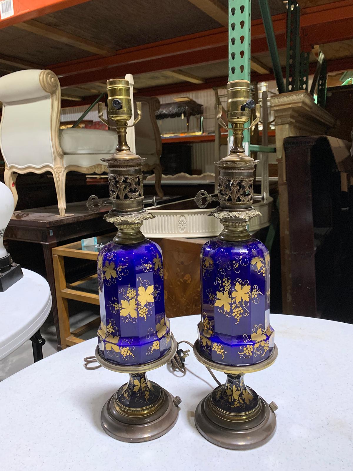 Pair of 19th-20th century cobalt blue and gilt glass oil lamps with grape leaf design
New wiring.
