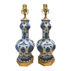 Pair of 19th-20th Century Delft Blue 
White Vases as Lamps, Custom Gilded Bases