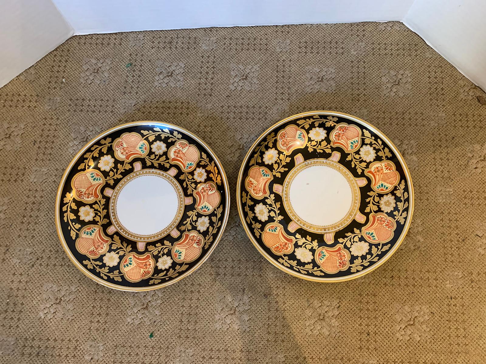 Pair of 19th-20th century English Porcelain dinner plates, black with gilt details, unmarked.