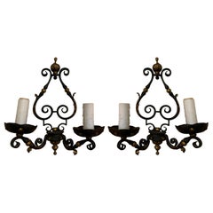 Pair of 19th-20th Century French Two-Arm Black Iron and Gilt Sconces