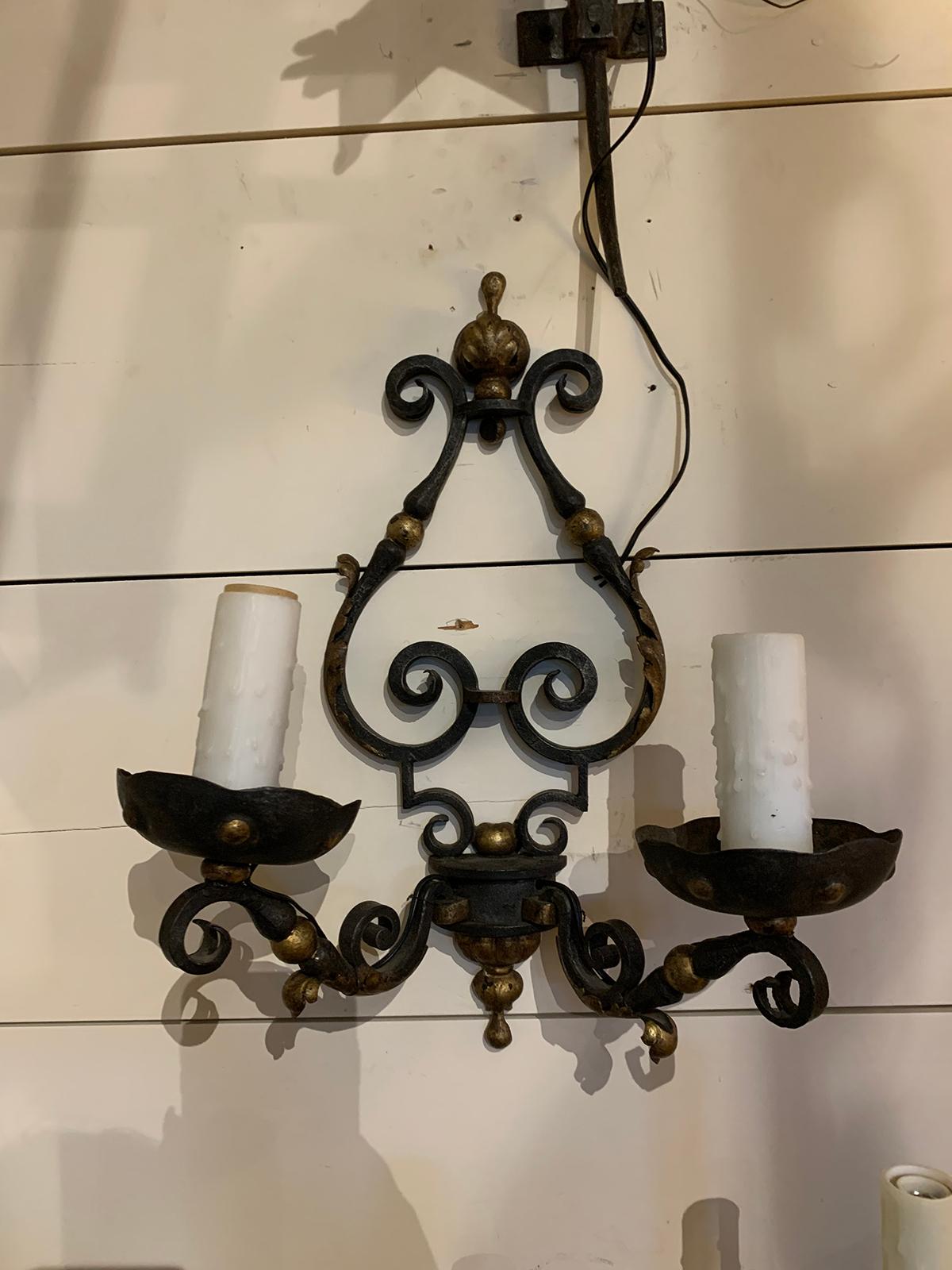 Pair of 19th-20th century French two-arm black iron and gilt sconces
New wiring.