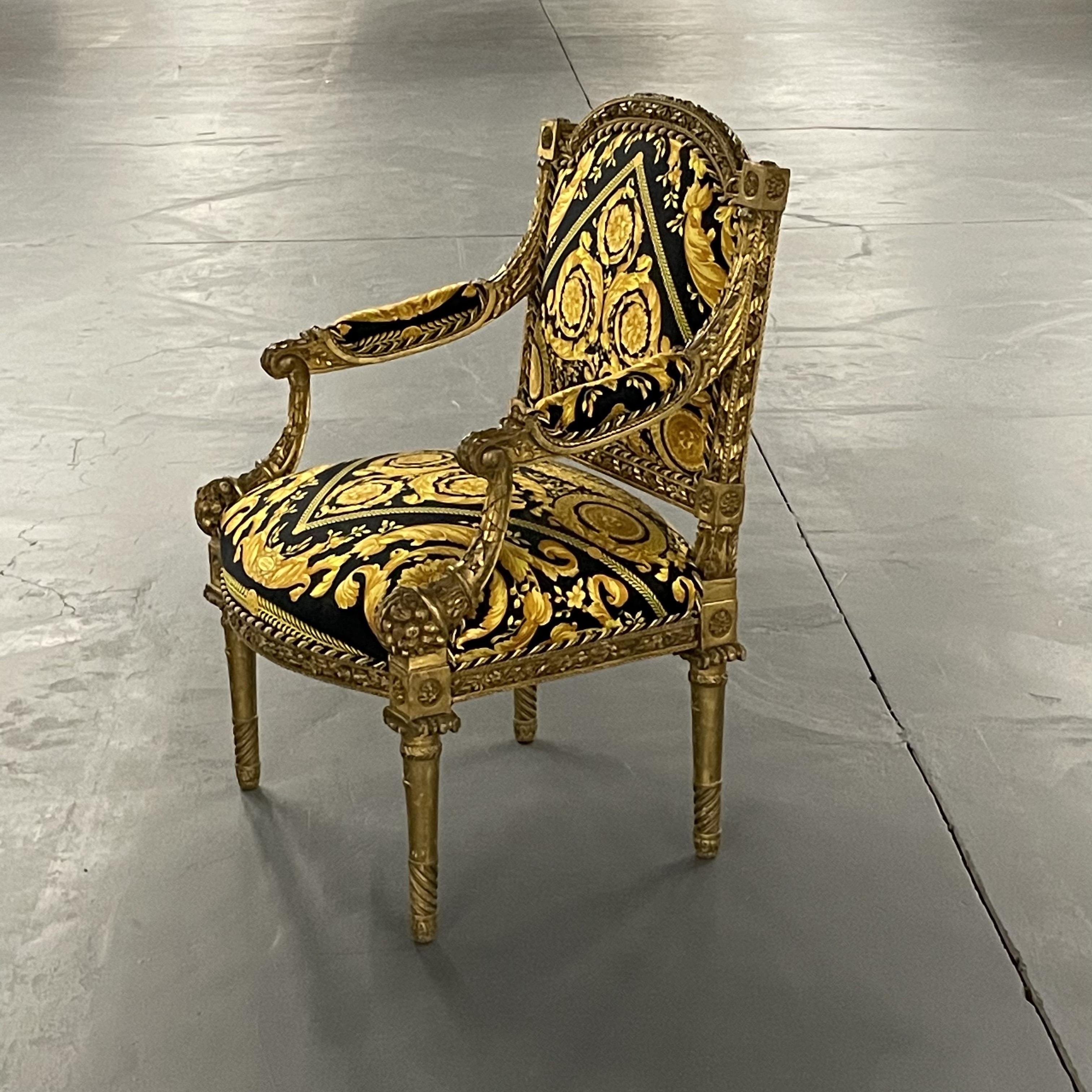 Pair of 19th-20th century Louis XVI style finely carved armchairs in Gianni Versace Fabric. These spectacular one of a kind antique walnut fauteuils or arm chairs would look breathtaking in any office or living room setting. The reeded Louis XVI