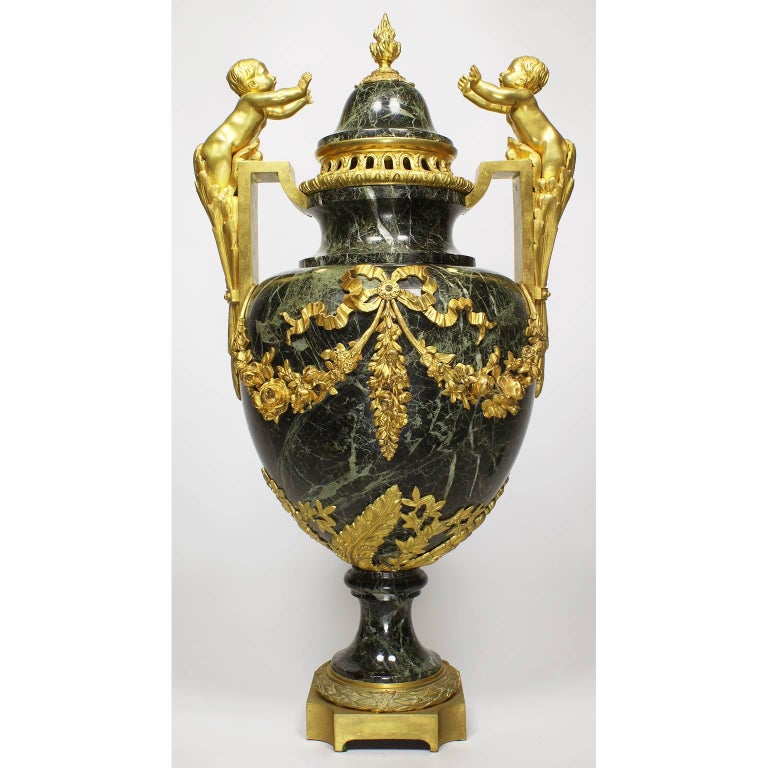 French Pair of 19th-20th Century Louis XVI Style Ormolu and Marble Urns with Children For Sale