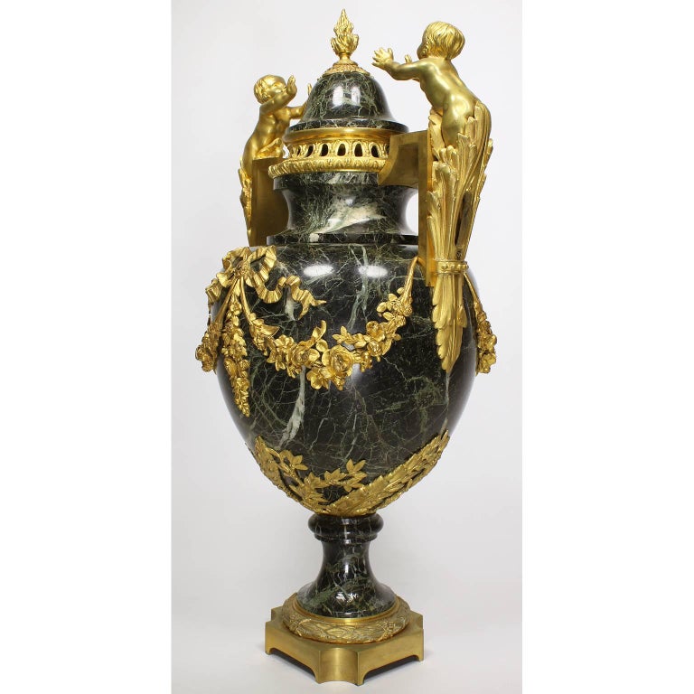 Gilt Pair of 19th-20th Century Louis XVI Style Ormolu and Marble Urns with Children For Sale