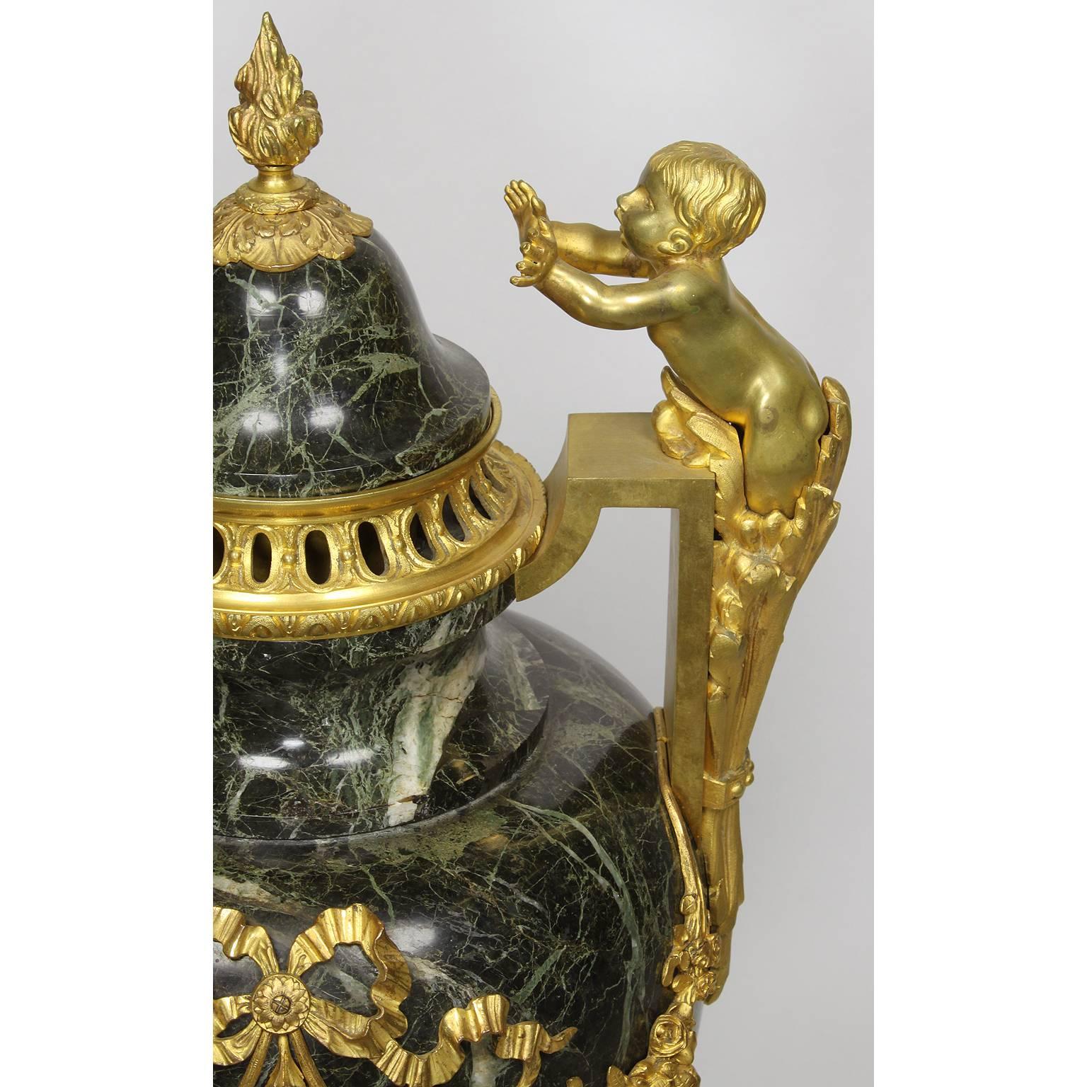 Pair of 19th-20th Century Louis XVI Style Ormolu and Marble Urns with Children For Sale 1