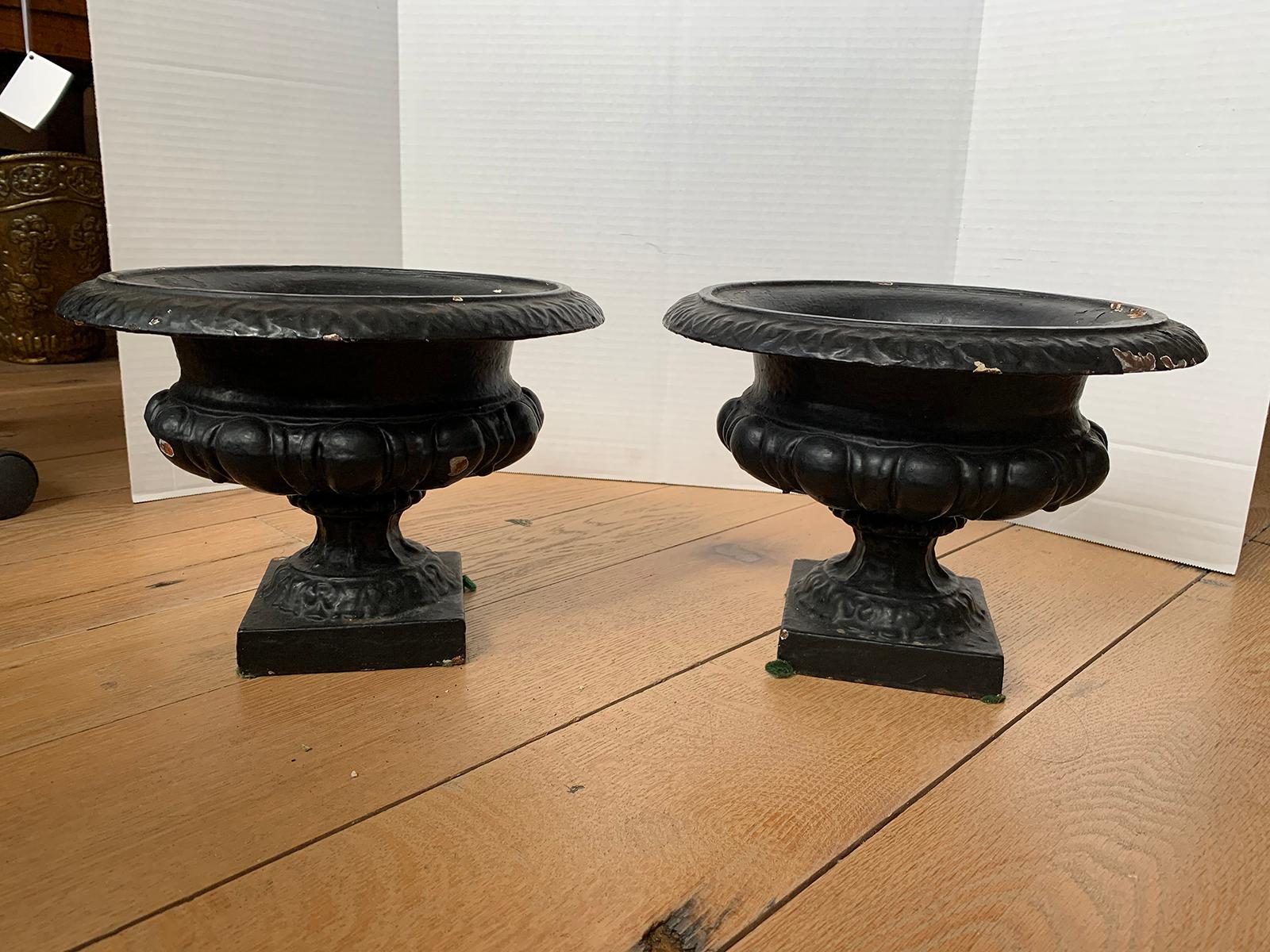 Pair of 19th-20th century neoclassical iron urns.