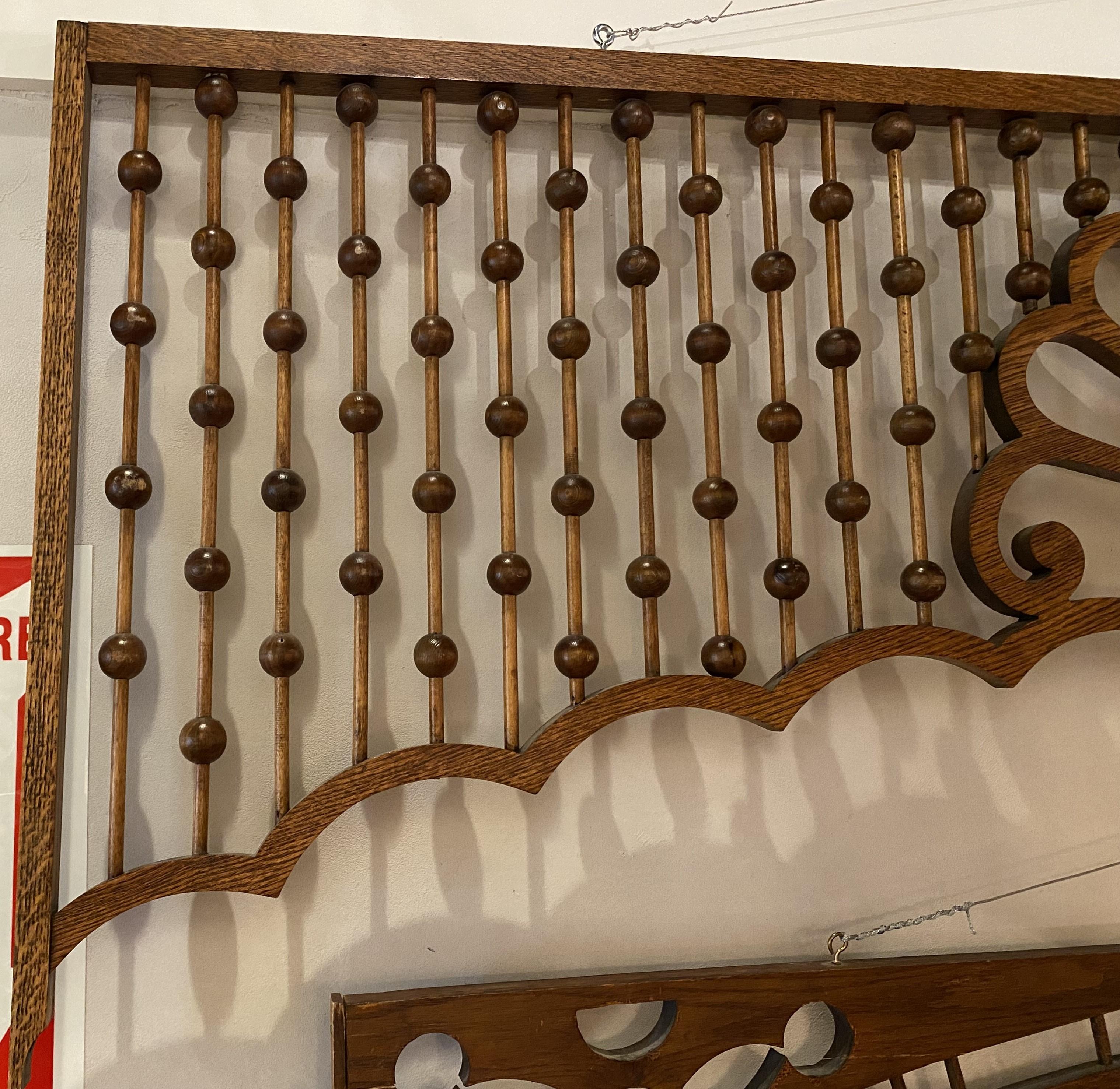 Nice examples of two different decorative oak stick and ball architectural elements, the larger wit a center shell or fan motif, probably American in origin, dating to the late 19th or early 20th century. Very good overall condition, with minor