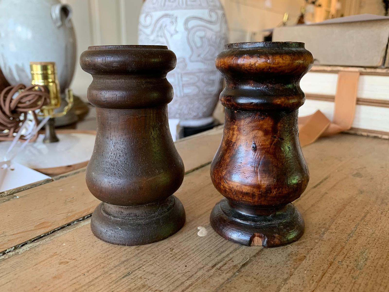 Pair of 19th-20th century turned wooden candleholders.