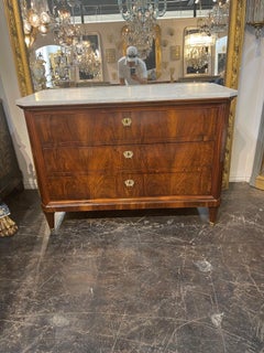 Pair of 19th Biedermeier Flame Mahogany Commodes with Marble Tops