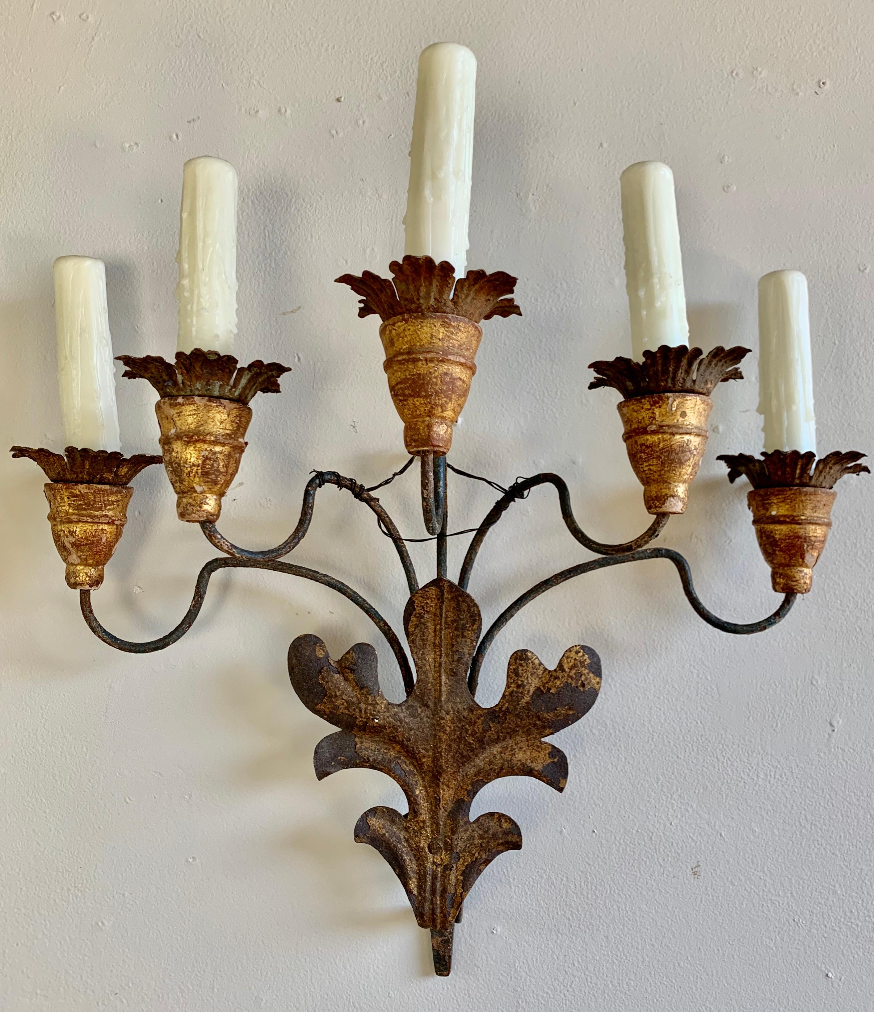 Pair of 19th century French 5-light iron & giltwood sconces that have been electrified with cream colored wax candle covers. The sconces are newly wired and ready to install.