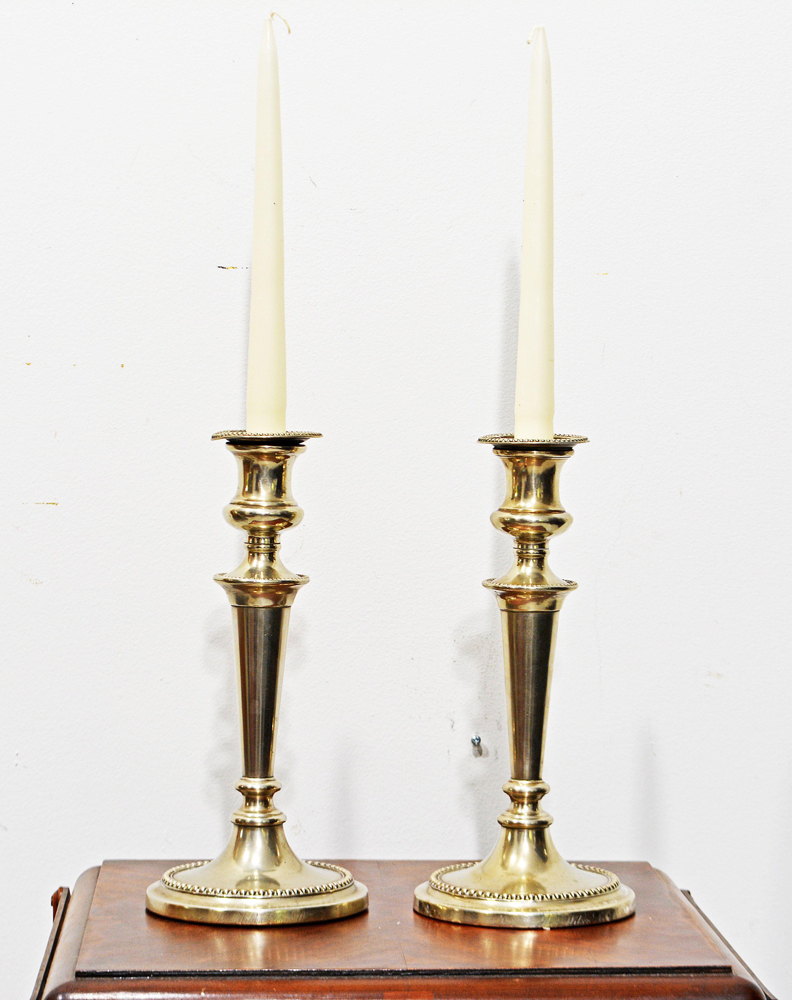 Fashioned in the Adam style with tapering stems and beaded edges these fine Sheffield cansle sticks are both inscribed on the bases 'Thos. Wilson Sons Co' Thomas Wilson was a silver smith in Sheffield in the late 19th and early 20th century. They