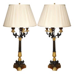 PAIR OF 19TH C CHARLES X GILT AND BRONZE CANDELSTICKS AS LAMPS
