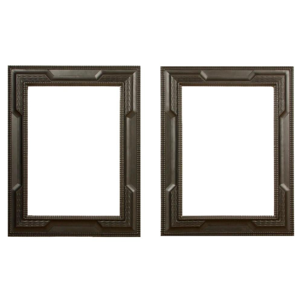 A pair of 19th C Dutch Style Ebonized Frame or Mirror with Blackened Carved Wood