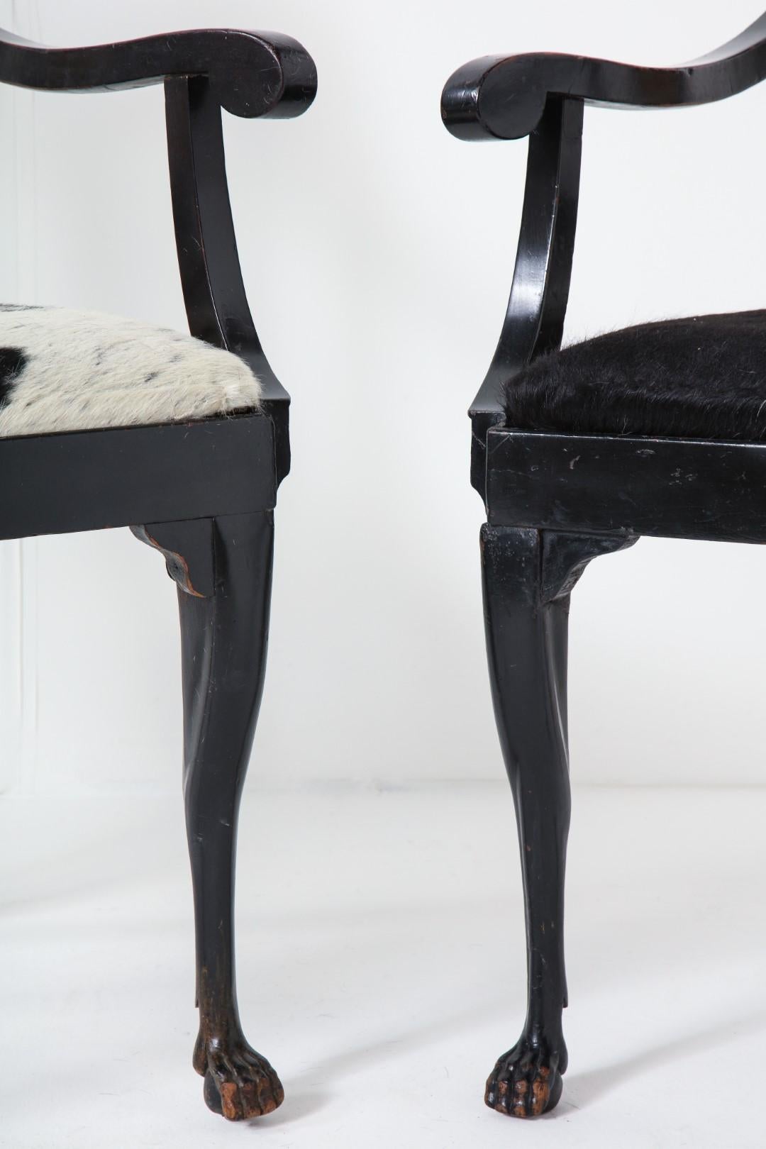 Hide Pair of Ebonized English Regency Armchairs with Pony Seats and Monogram For Sale