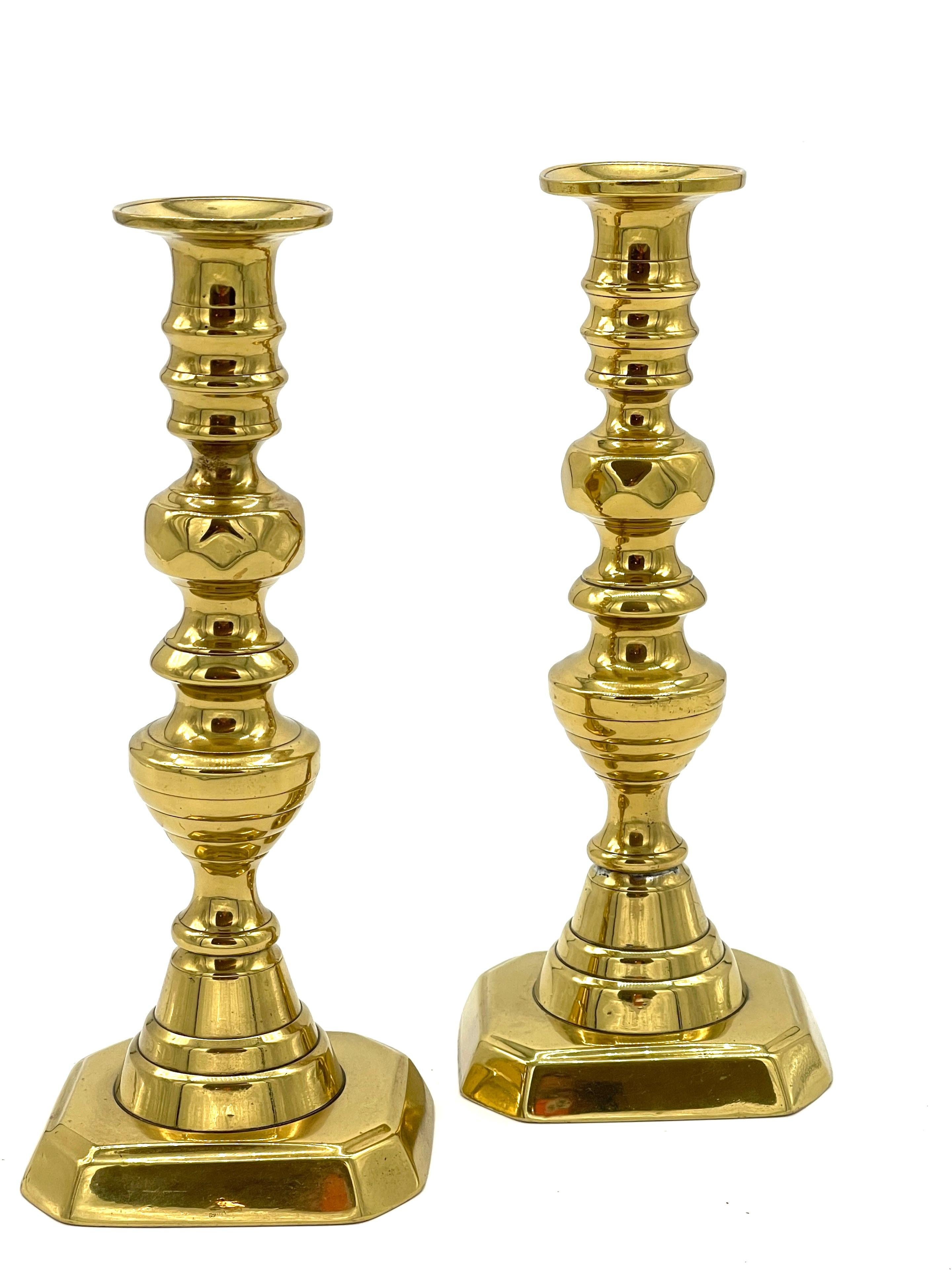Pair of  19th C. English Brass Beehive Push Up Candlesticks 
England, Circa 1880s

Add a touch of history and elegance to your home with this pair of 19th century English brass beehivepush up candlesticks, originating from England in the 1880s.