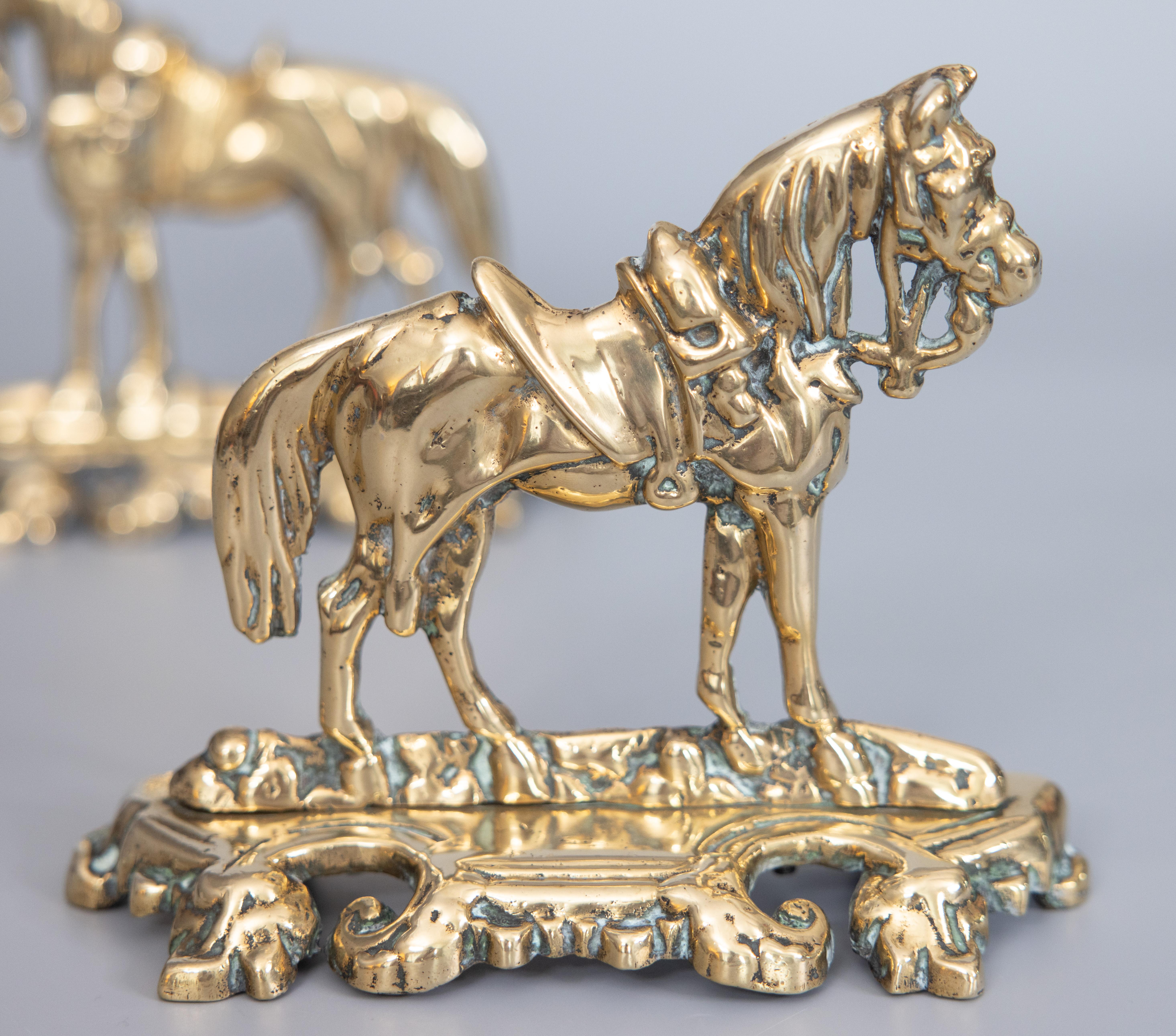 A super pair of 19th-Century English cast brass mantel horses on decorative bases, circa 1870. These handsome horses are large, well made and heavy weighing over 6 lbs, with fine details. They would be perfect on a fireplace mantel, displayed on a