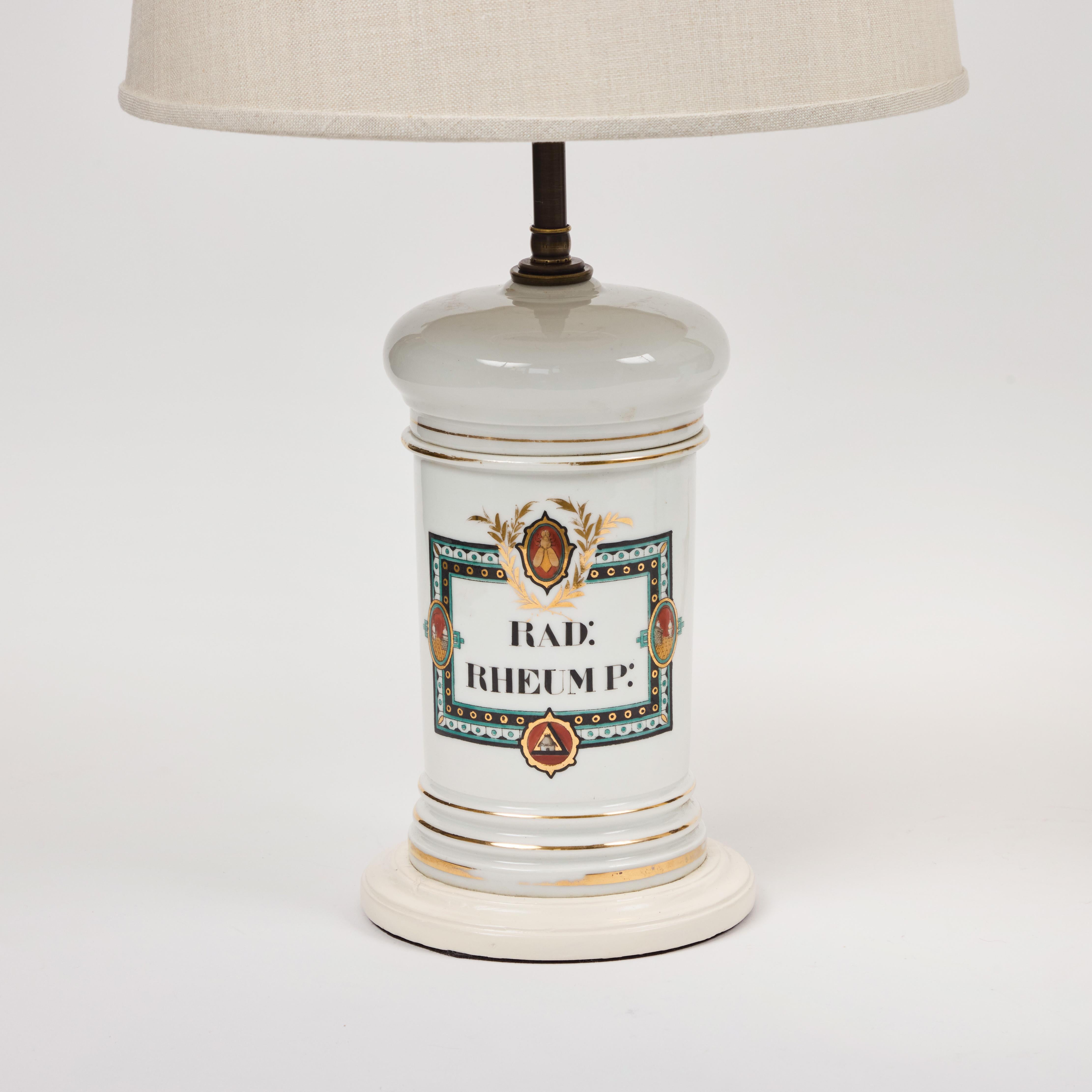 W​e love this pair of fantastic​ 19th c French ​antique porcelain​ ​apothecary ​jar​ table ​lamps. ​These jars are white porcelain with intricately hand painted labels that include a bee, a few medallions, a rich border, hand lettering and gilded