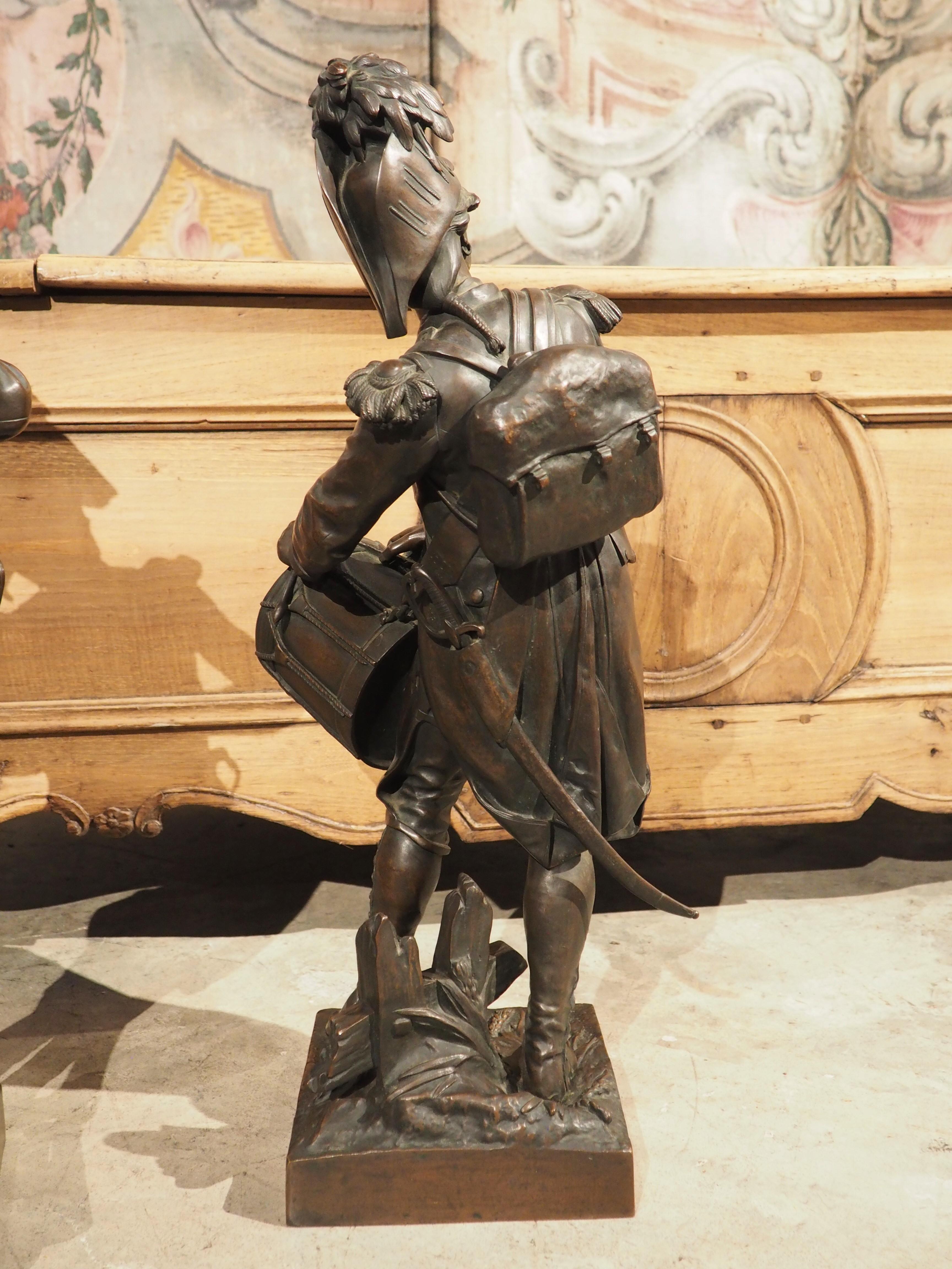 Standing over 2 feet tall, these high quality bronze statues depict soldiers during the French revolutionary wars. They are labeled and signed Dumaige (French sculptor, Etienne-Henry Dumaige 1830-1888). The statues show incredible detail, excellent