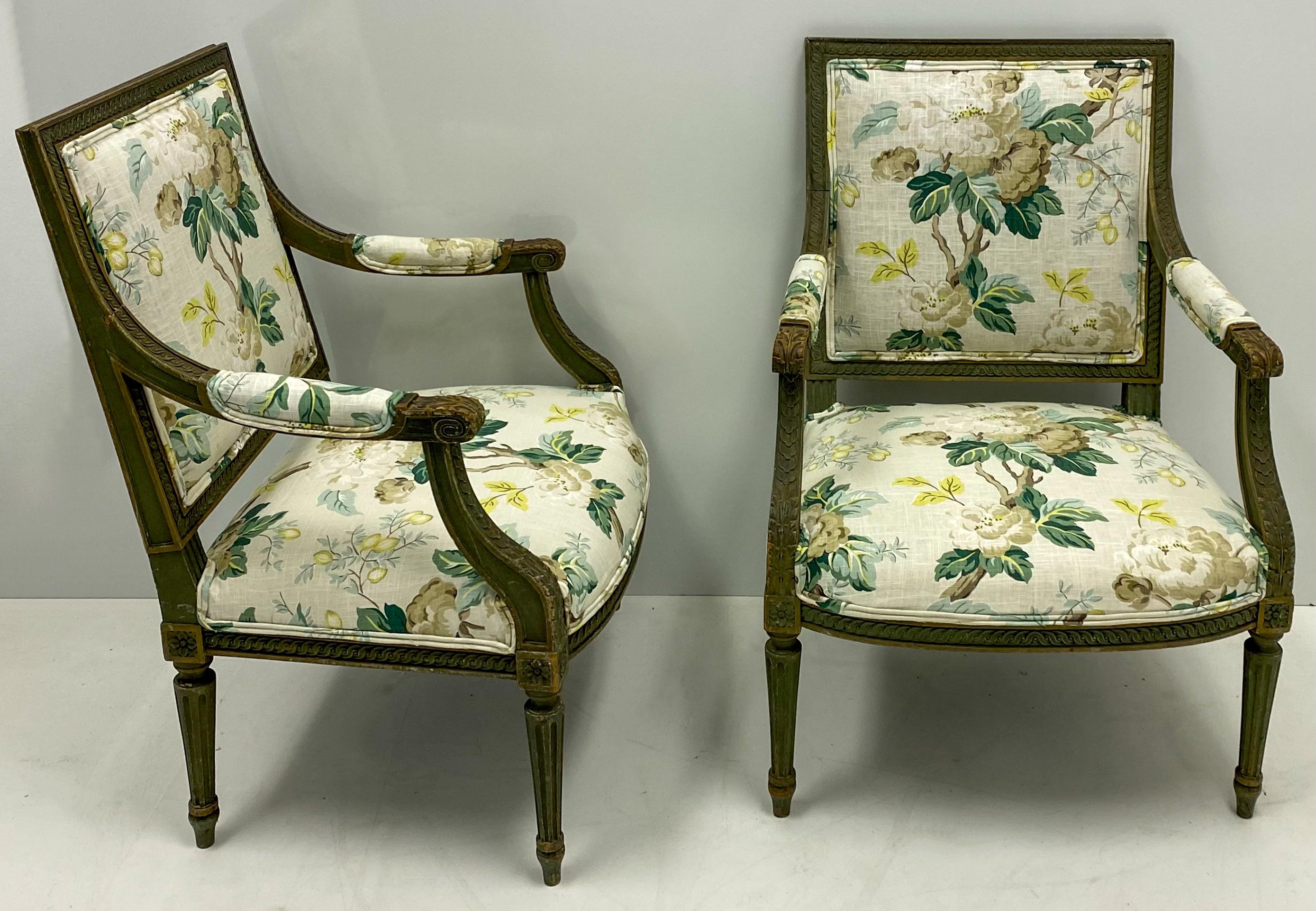 This is a wonderful pair of French bergère chairs newly recovered in a Charlotte Moss floral linen. The frames are in original green paint. The seats are 17” H, and the arms are 25.5”.