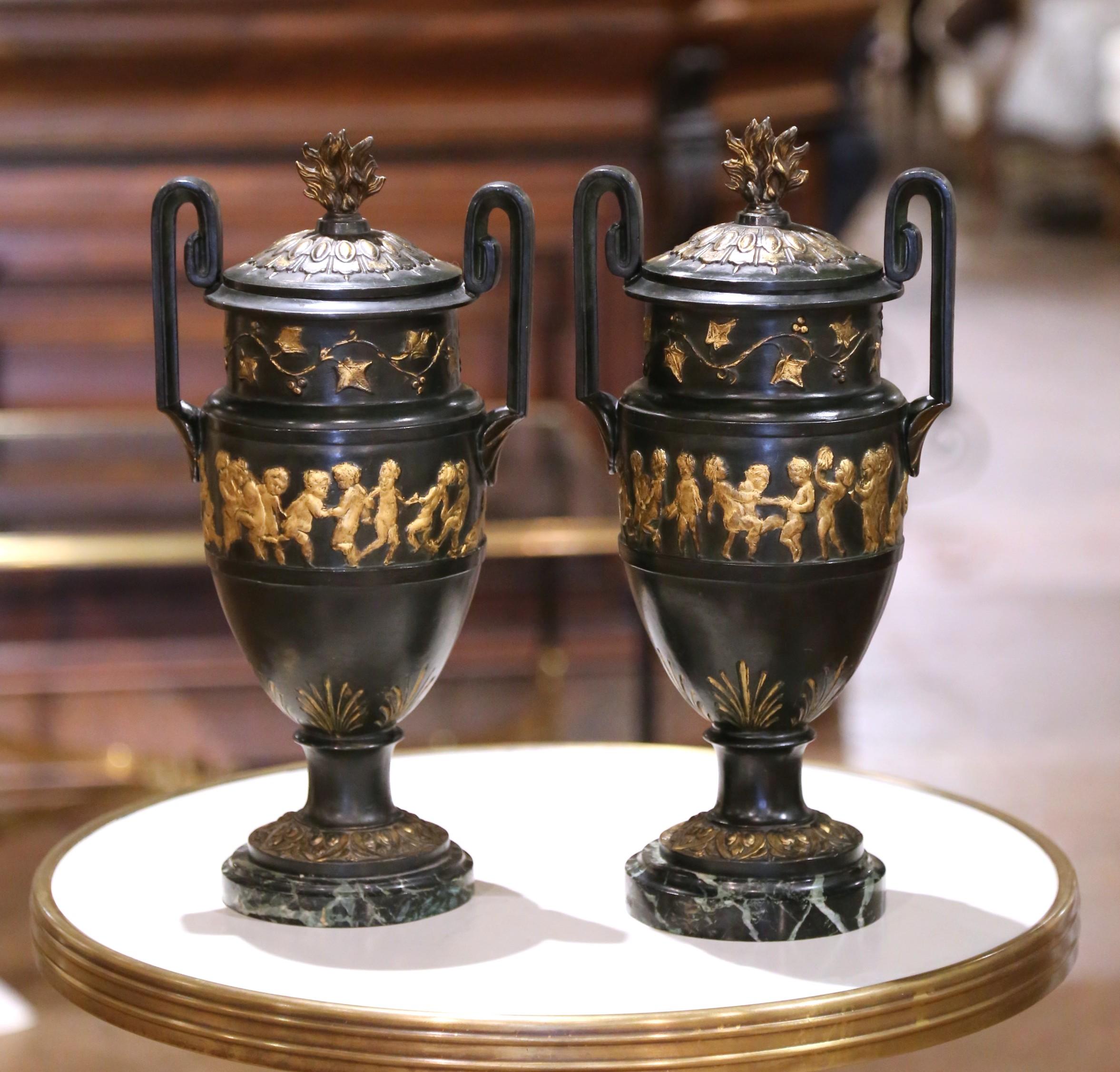 Hand-Carved Pair of 19th C. French Neoclassical Cast Iron Cassolettes Urns on Marble Bases For Sale