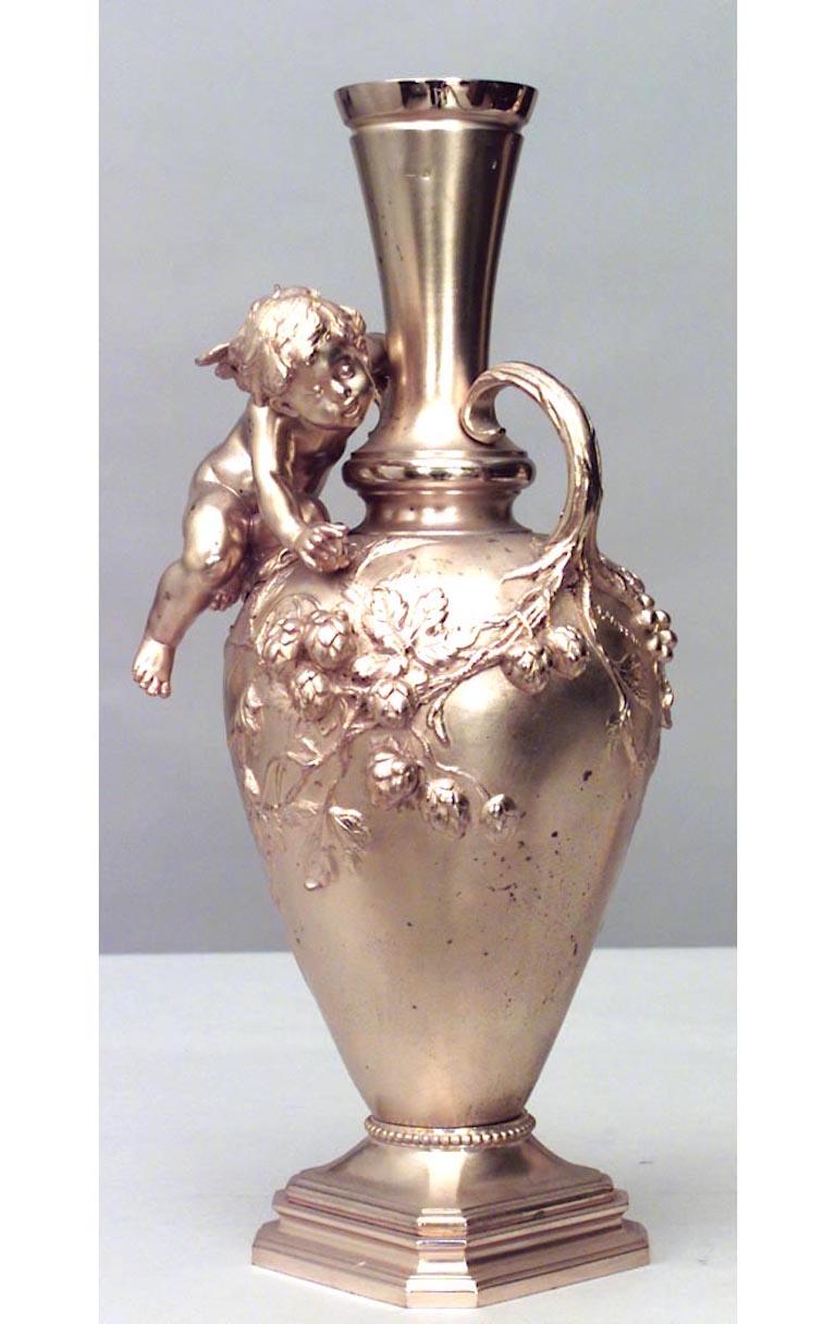 Pair of French Victorian bronze dore vases with floral relief and seated cupid with small handles (signed A. MOREAU) (PRICED AS Pair)
