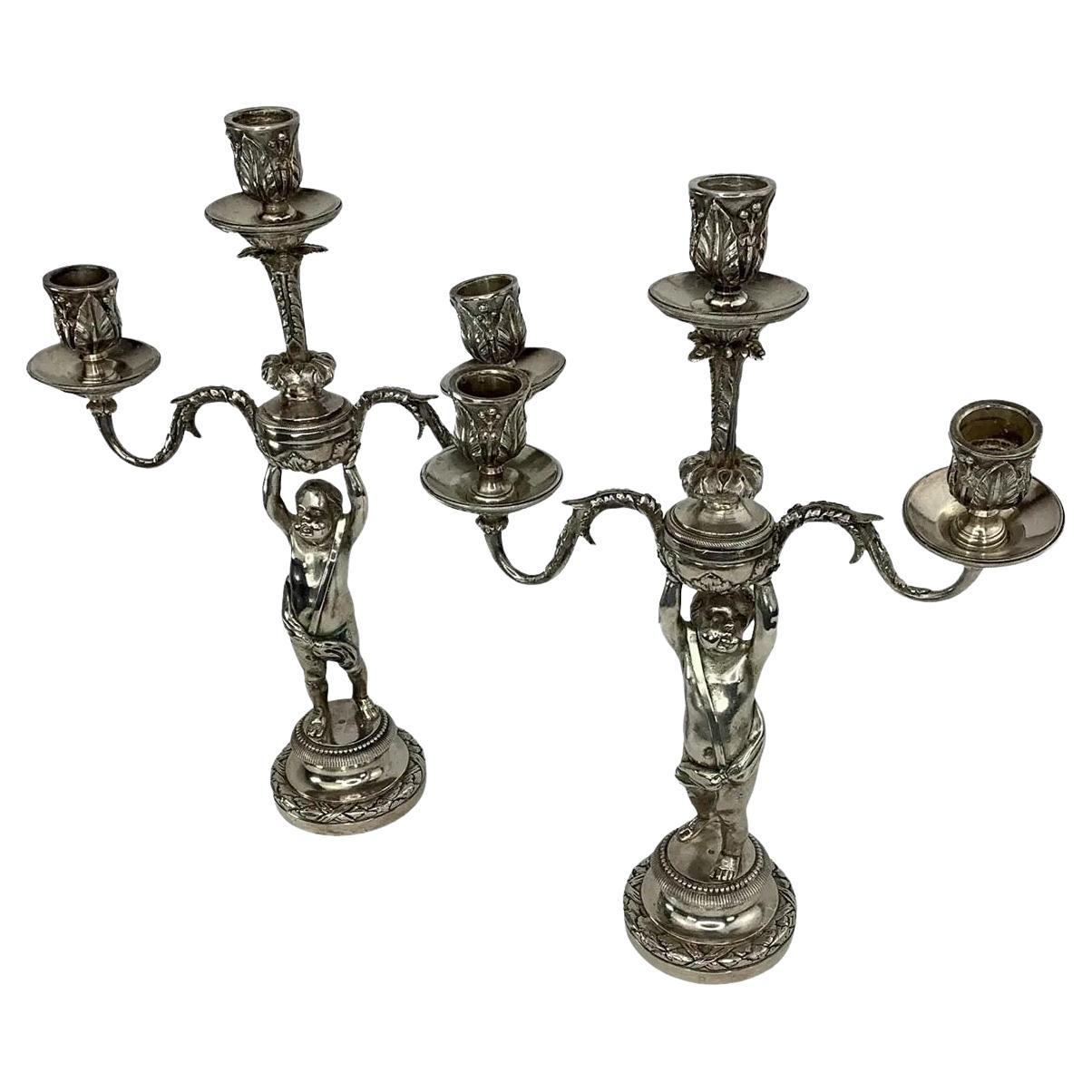 Paire de chandeliers Putti en bronze argenté du XIXème siècle.