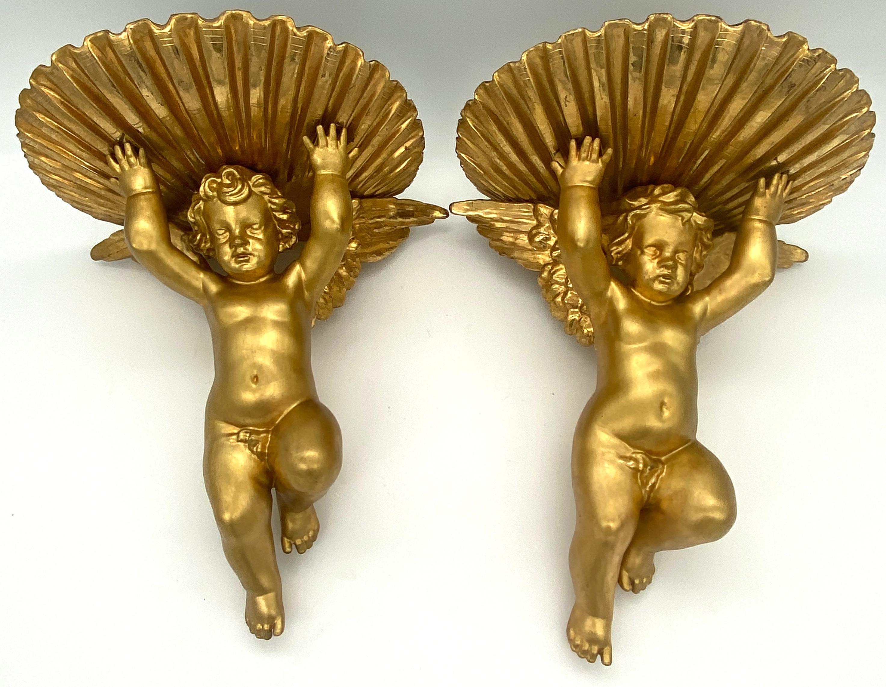 Pair of 19th Century Italian Grotto Carved Giltwood Putti & Shell Wall Brackets
Italy, Circa 1850s

An exquisite pair of 19th Century Italian Grotto Carved Giltwood Putti & Shell Wall Brackets, originating from Italy in the 1850s. These captivating
