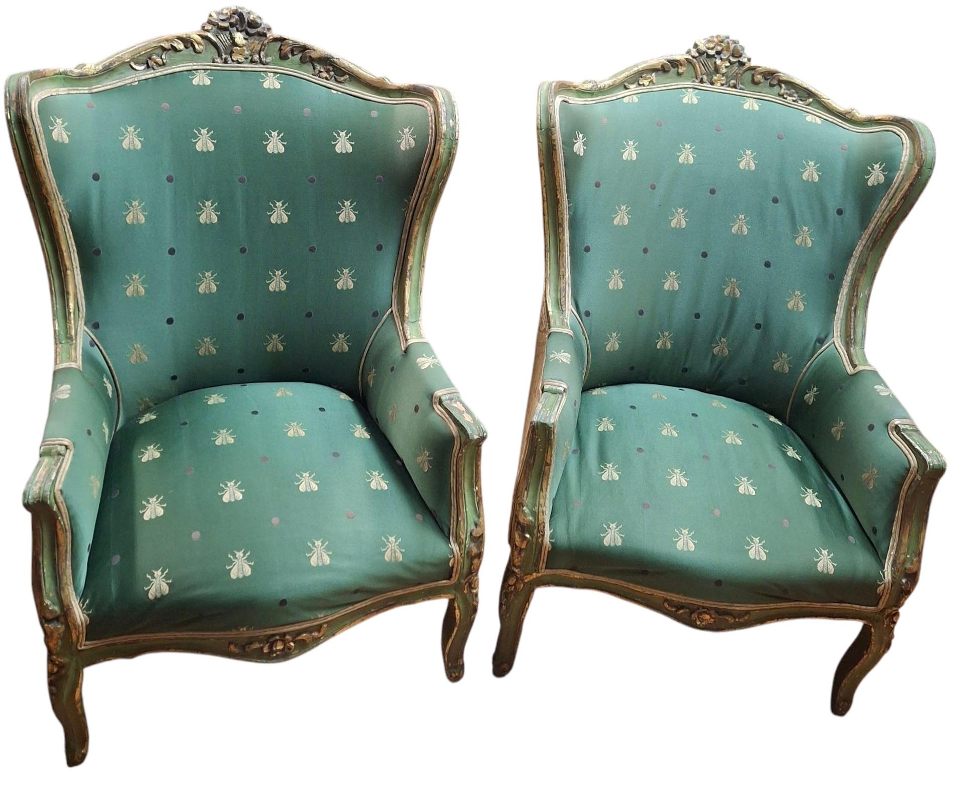 Lovely pair of 19th century Louis XV style wingback armchairs with later brocade upholstery.  Chair frames appear to have been repainted/touched up over the years but are structurally sound.  Seat springs still good although the seats could use new