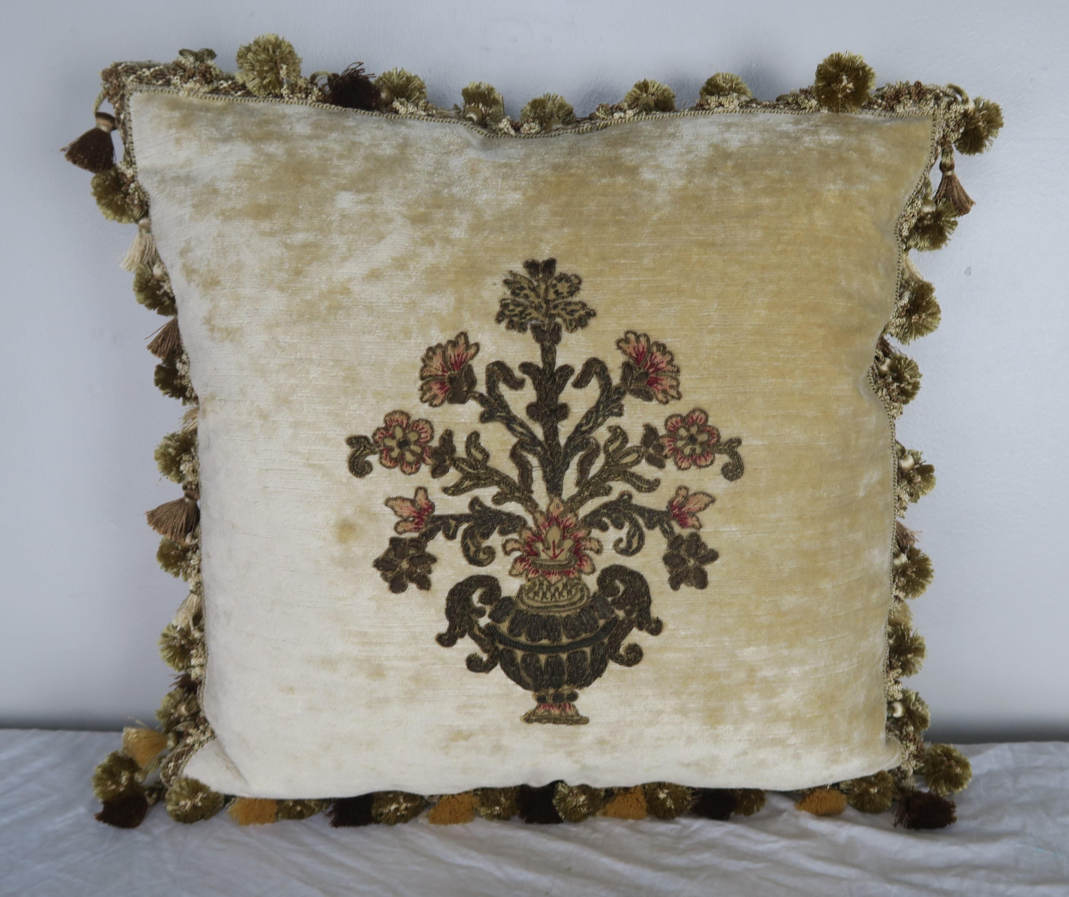Pair of custom pillows designed by Melissa Levinson. The pillows are made with 19th century French metallic and chenille hand embroidered textiles appliqued to cream colored linen velvet. The textiles depict an urn overflowing with flowers. A multi