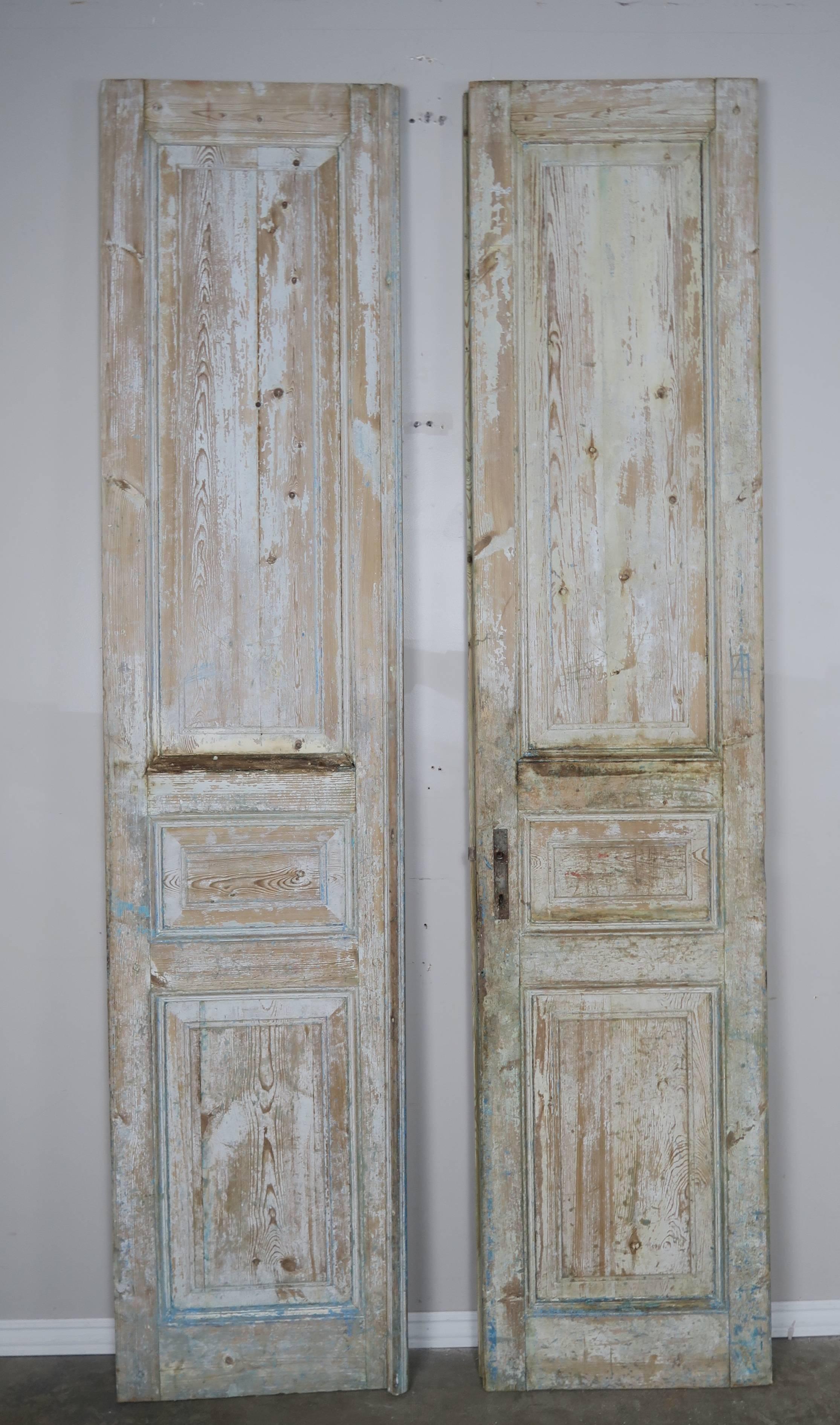 Pair of 19th century painted pine wood doors with original hardware.