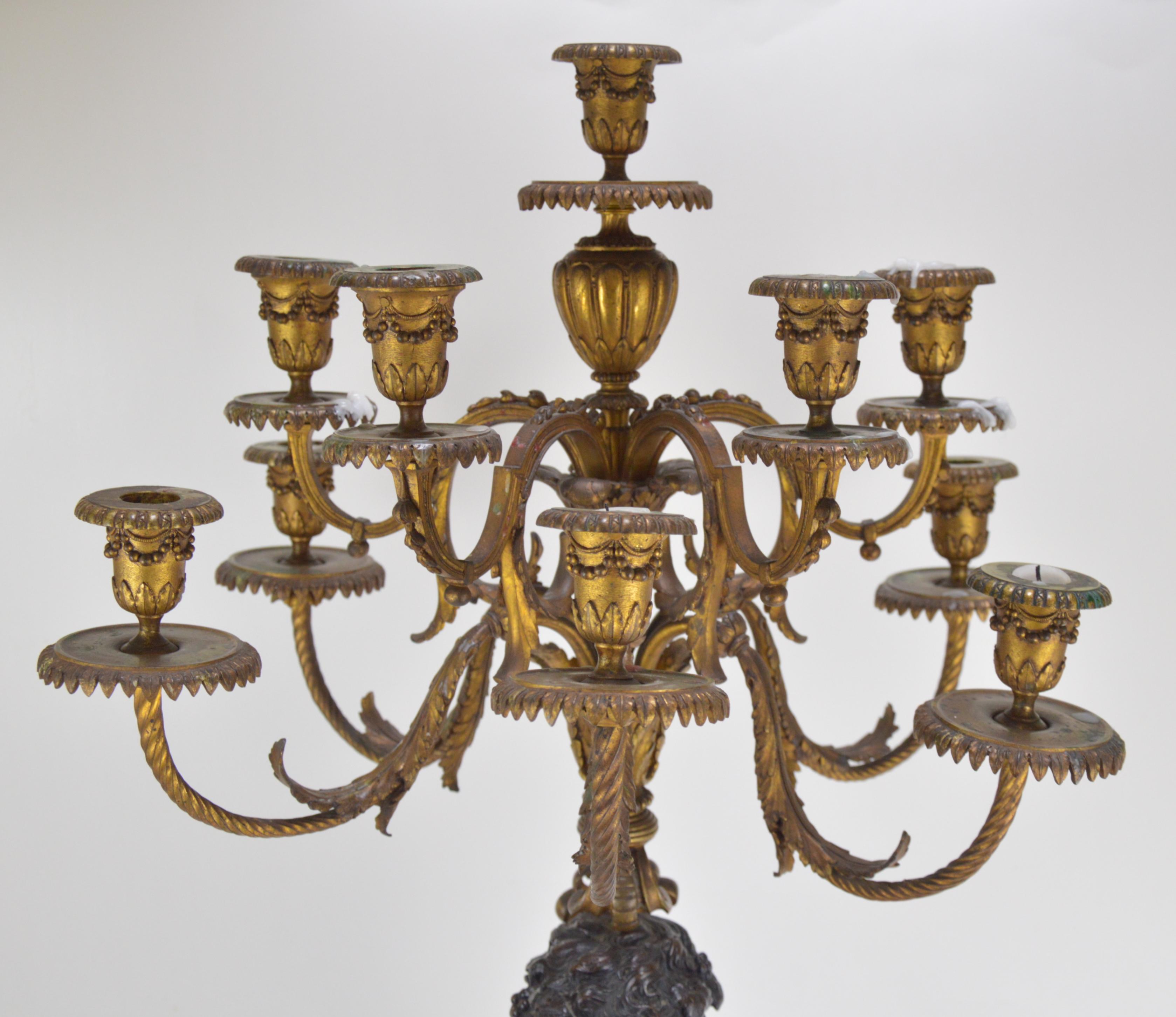 Pair of 19th Century Patinated and Gilt Bronze Candelabra Representing Fauns In Good Condition In Brussels, BE